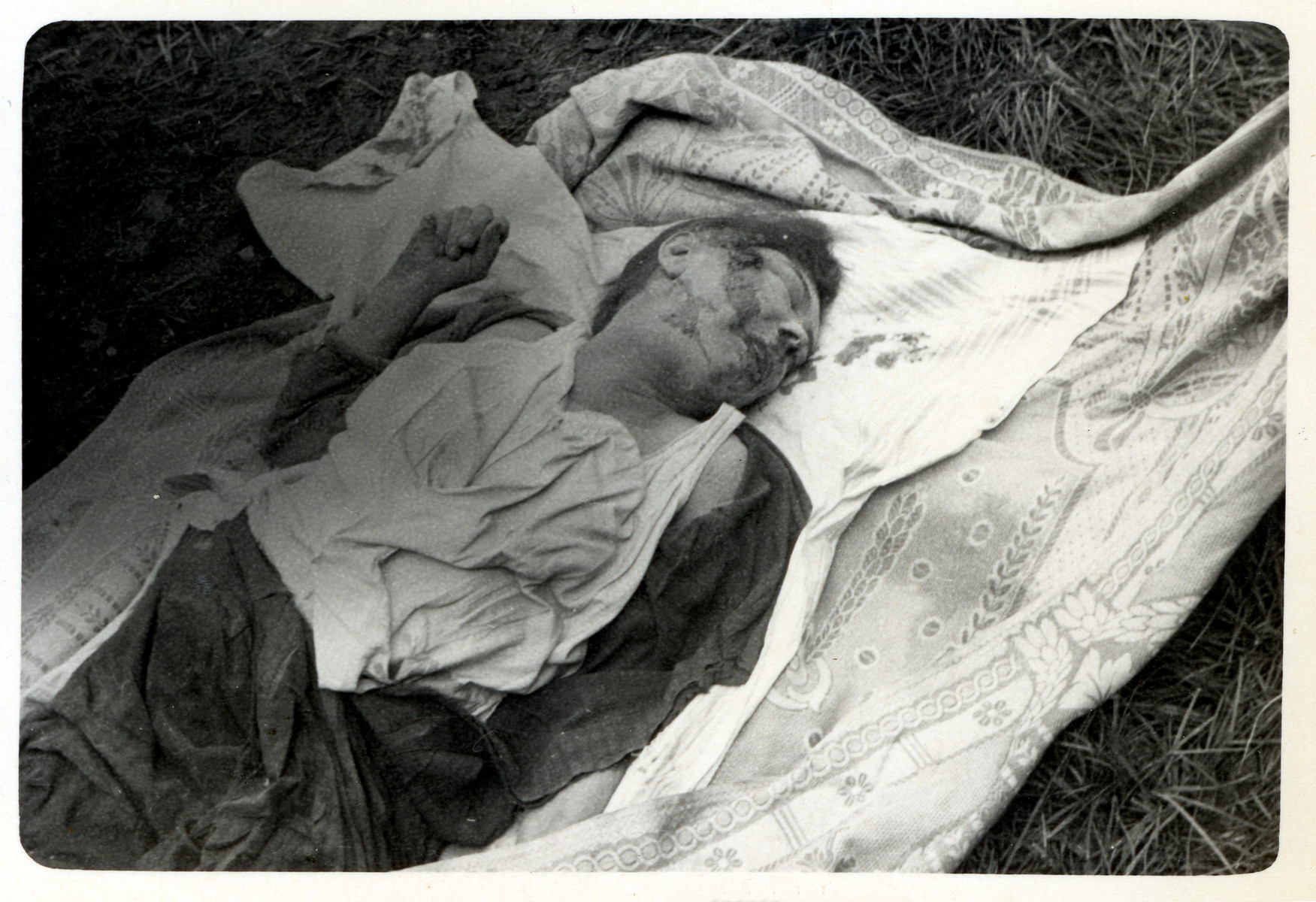 The corpse of a Polish victim of a German air raid lies on the ground in besieged Warsaw.