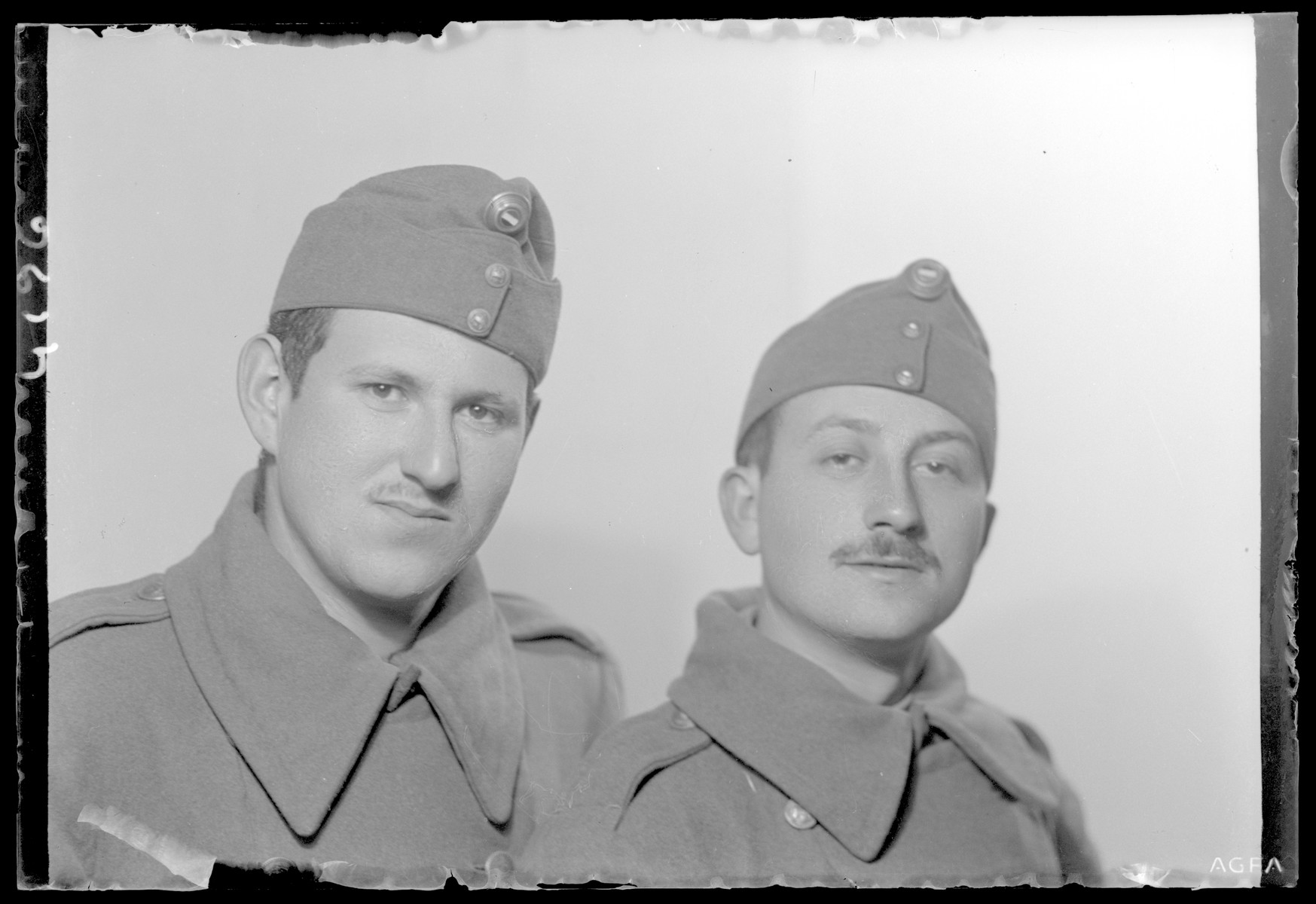 Studio portrait of Bela Fischer in a military uniform with another soldier.