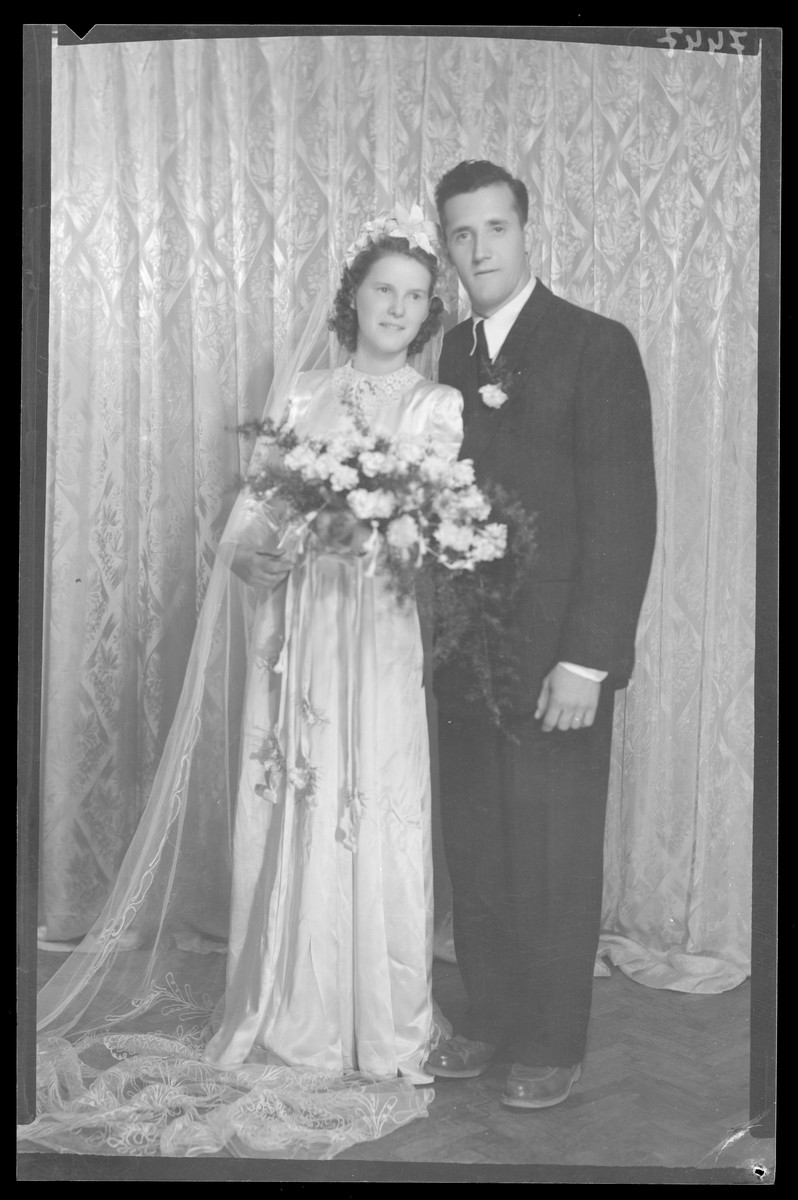 Studio wedding portrait of an unidentified couple.