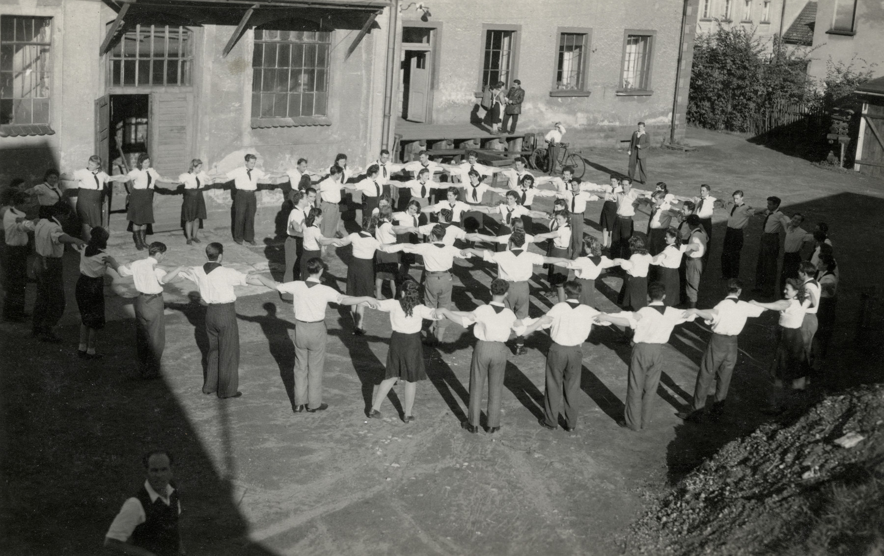 Zionist youth dance a hora in the Ludwikowo children's home.