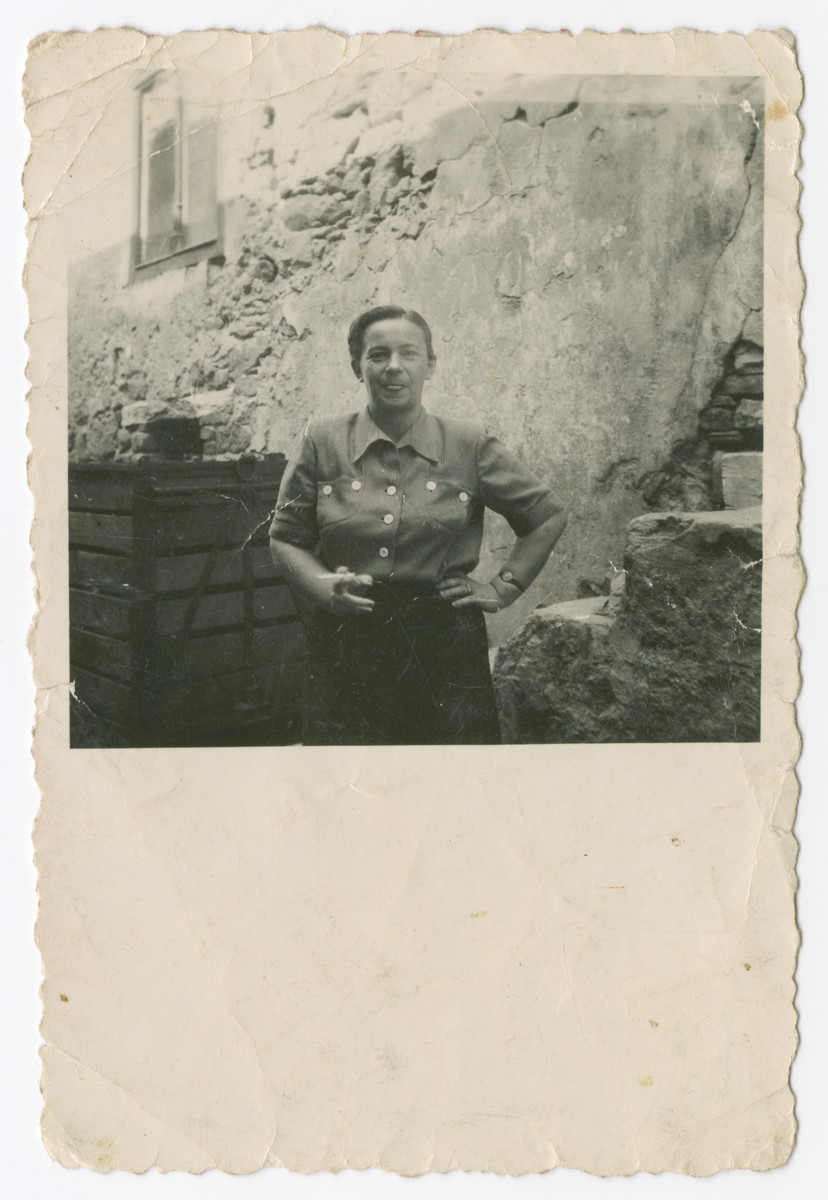 Bertha Leitner stands in front of her home [possibly before the war]..