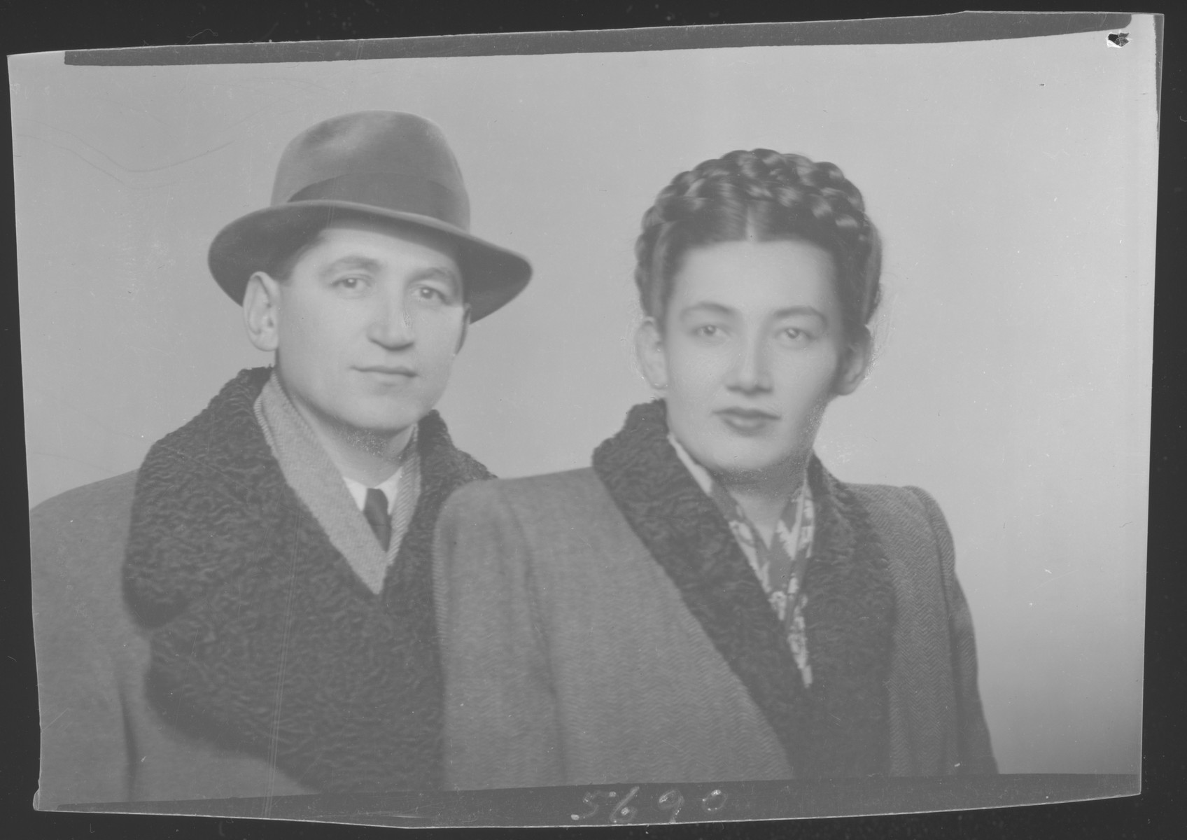 Studio portrait of  Matei Rosenfeld and wife, Lili (Kaufman) Rosenfeld. They able to immigrate to Sydney, Australia.