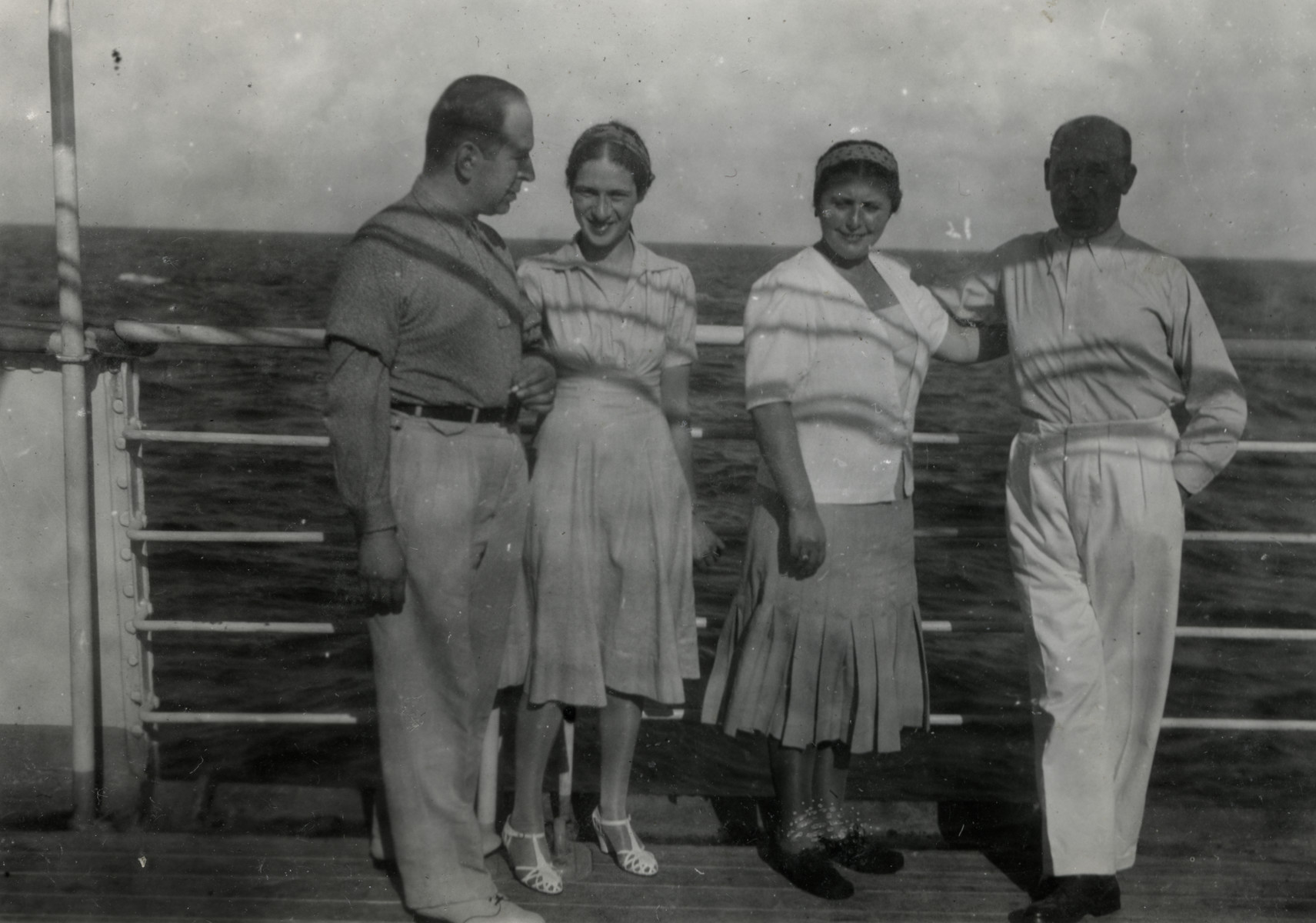 Refugees pose on the deck of a ship headed for Haita.

On the left are Herta and Walter Meinberg.