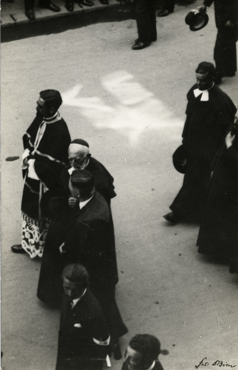 Clergy march in the funeral procession of Mayor of Szeged. 

Rabbi Immanuel Low is in front,; Rabbi Jeno Frenkel is in the back row.