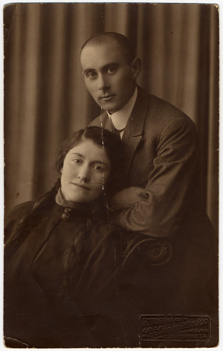 Studio portrait of a Jewish couple in Eisiskes.

Pictured are Peshe (nee Revinsky) and Herman.  The photos is inscribed to Peshe's brother and sister-in-law, Gittel and Arye Leib (later Gertrude and Louis), who had immigrated to America.