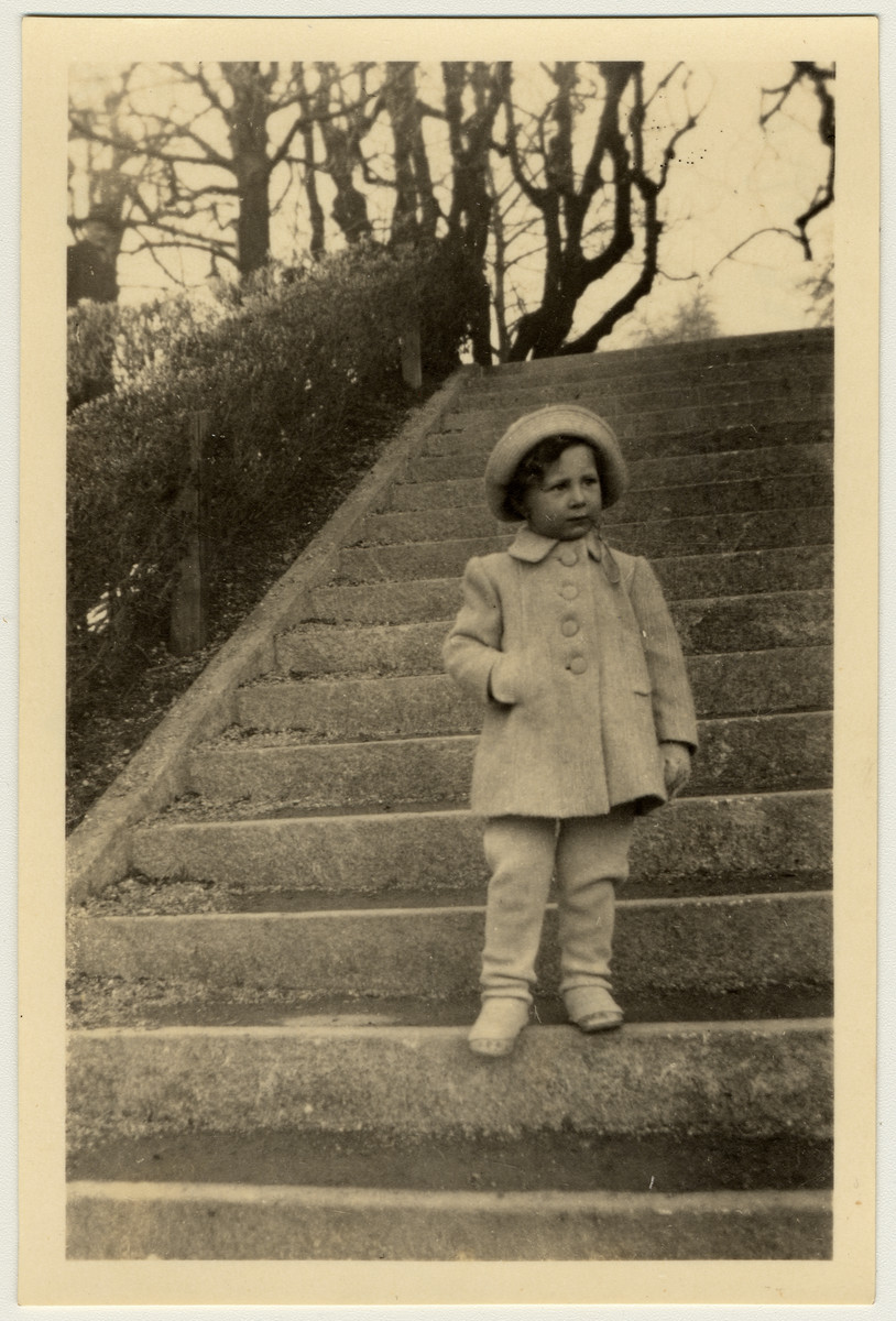Ursi Herzog (the little girl Ruth au paired for in Zurich) stands on some outdoor steps.