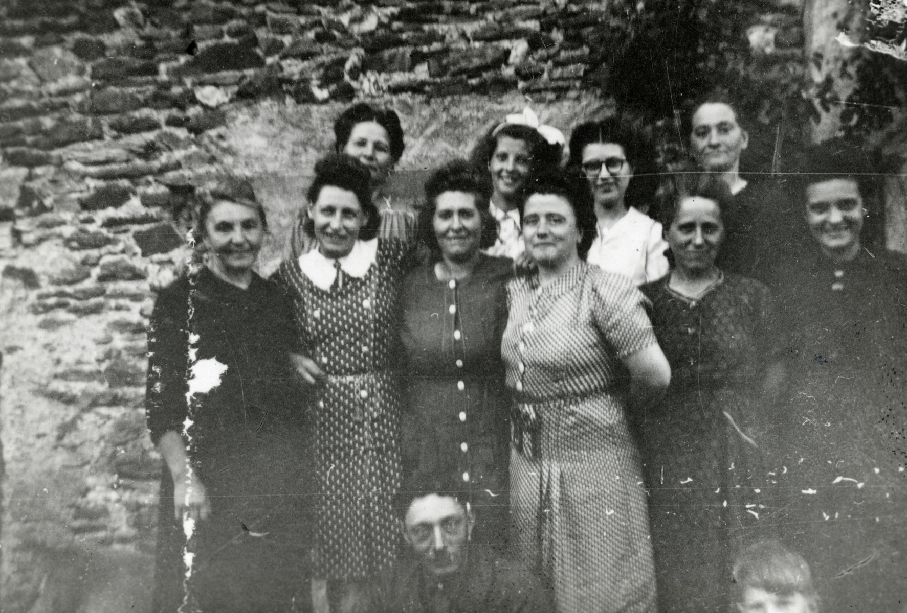 Nine women and a girl pose outside a building. 

Pictured second from the left is Rosa Moses, mother of the donor. Jean Gasser is sitting down in front of the group.