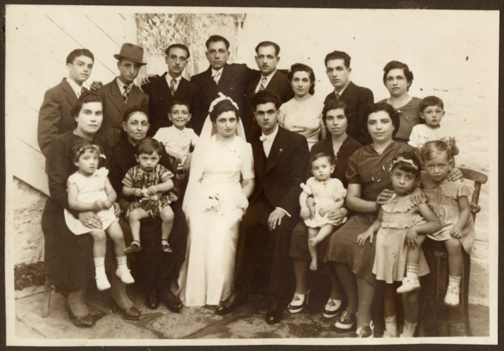 Wedding portrait of an extended Jewish family in Greece.

Pictured is the Vitalis family.  Everyone perished except for Rosa Vitalli Ackou and her five children.