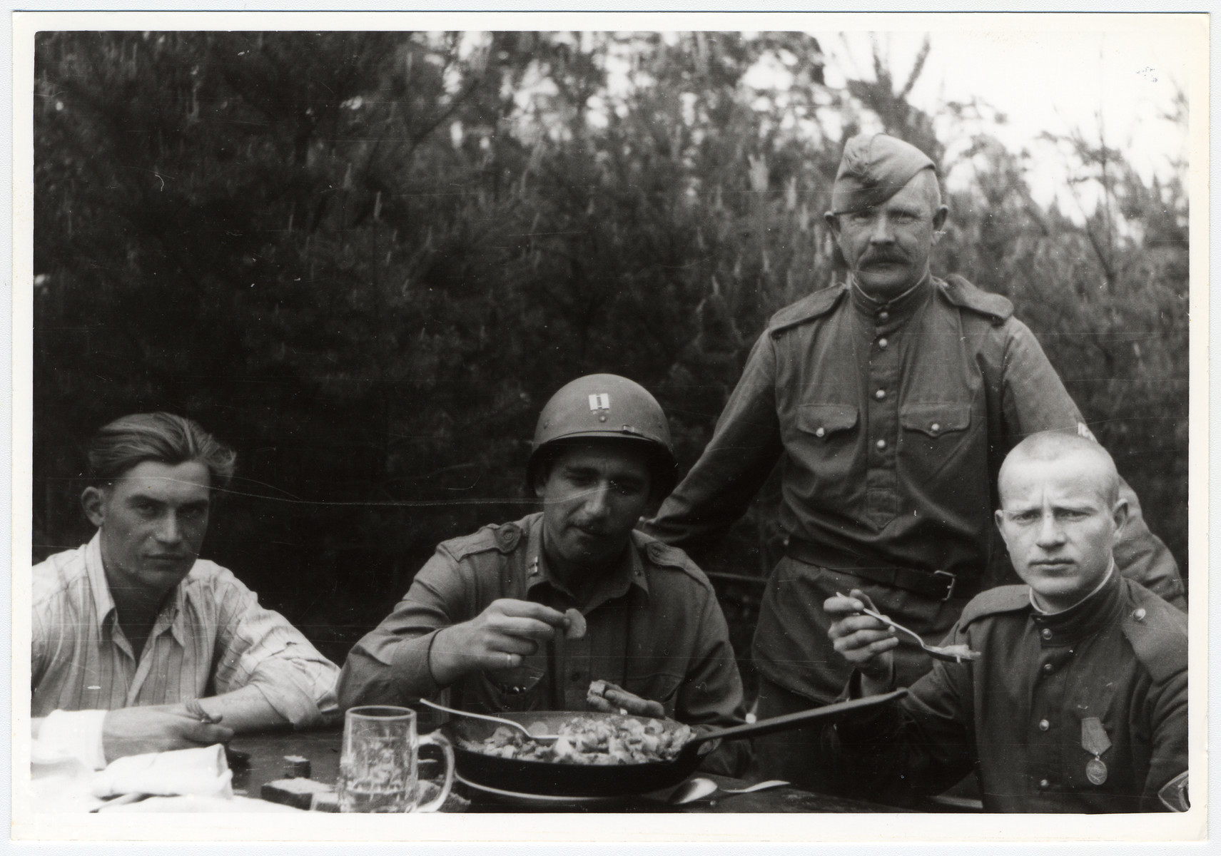 American and Russian soldiers share a meal.

Among those pictured is the donor, Louis Drucker.