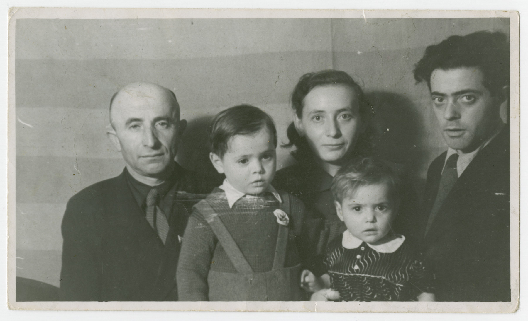 Postwar portrait of the Fridling family in the Schlachtensee displaced persons camp.

From left to right are Abe, Joseph, Gitla, Andzia (Chana) and Abe Fridling.  (The two Abe Fridlings were cousins.)