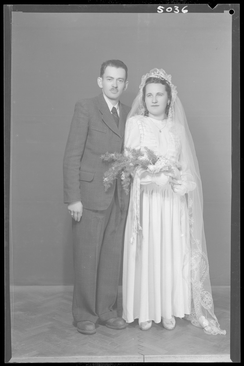 Studio wedding portrait of Jeno Wioer and his bride.