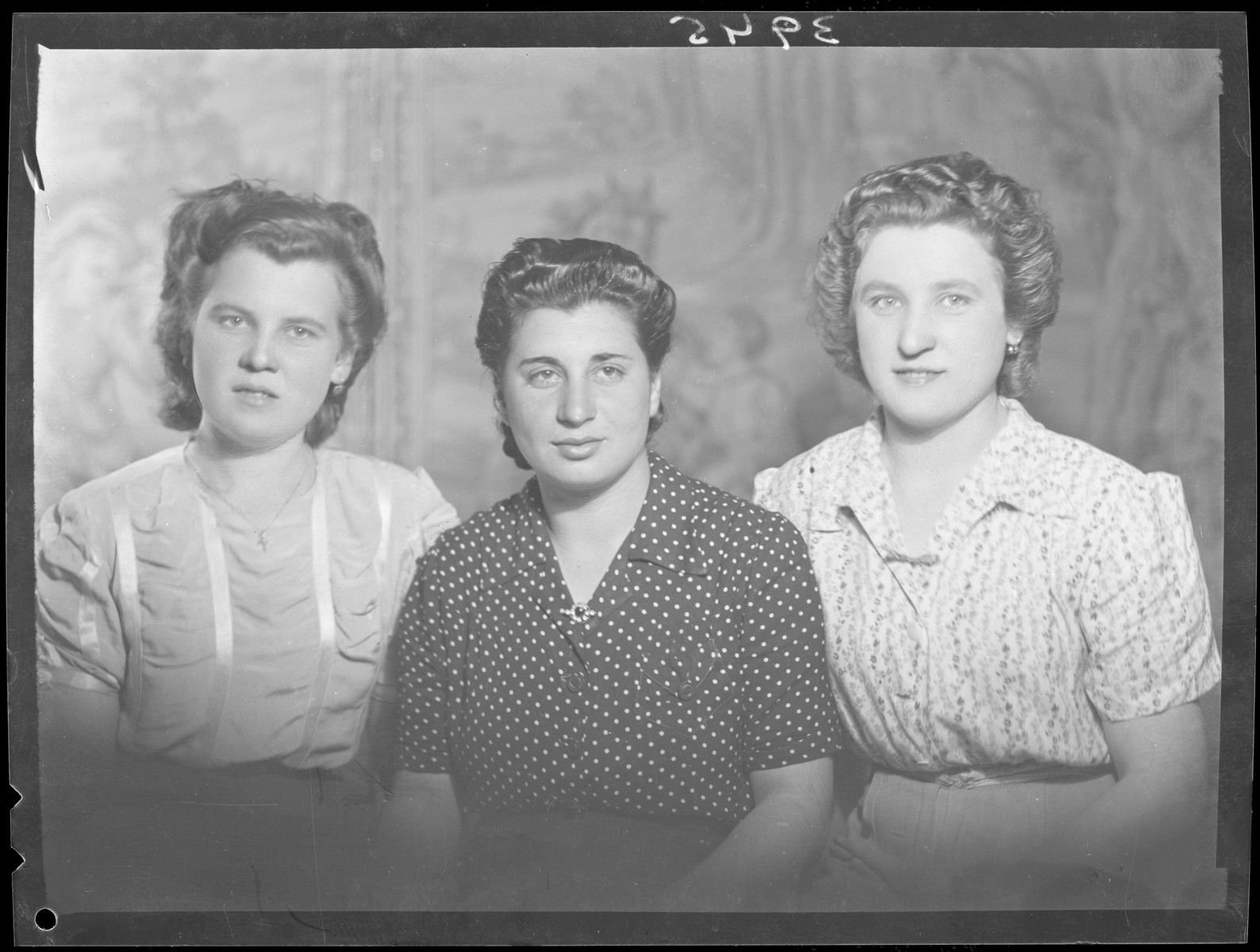 Studio portrait of Roszi Wizenfelder and two other women.