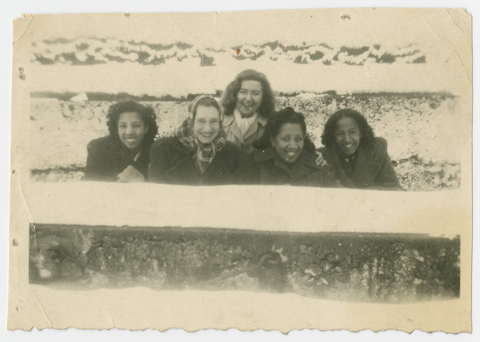 Group portrait of American women in the Liebenau internment camp.

Liebenau, located on Lake Constance close to Meckenbeuren, was opened in 1940 and operated until 1945.  It was used as an assembly point for prisoners who were being considered for exchange.

Among those pictured are Marilyn, Ida and Jacqueline Johnson.