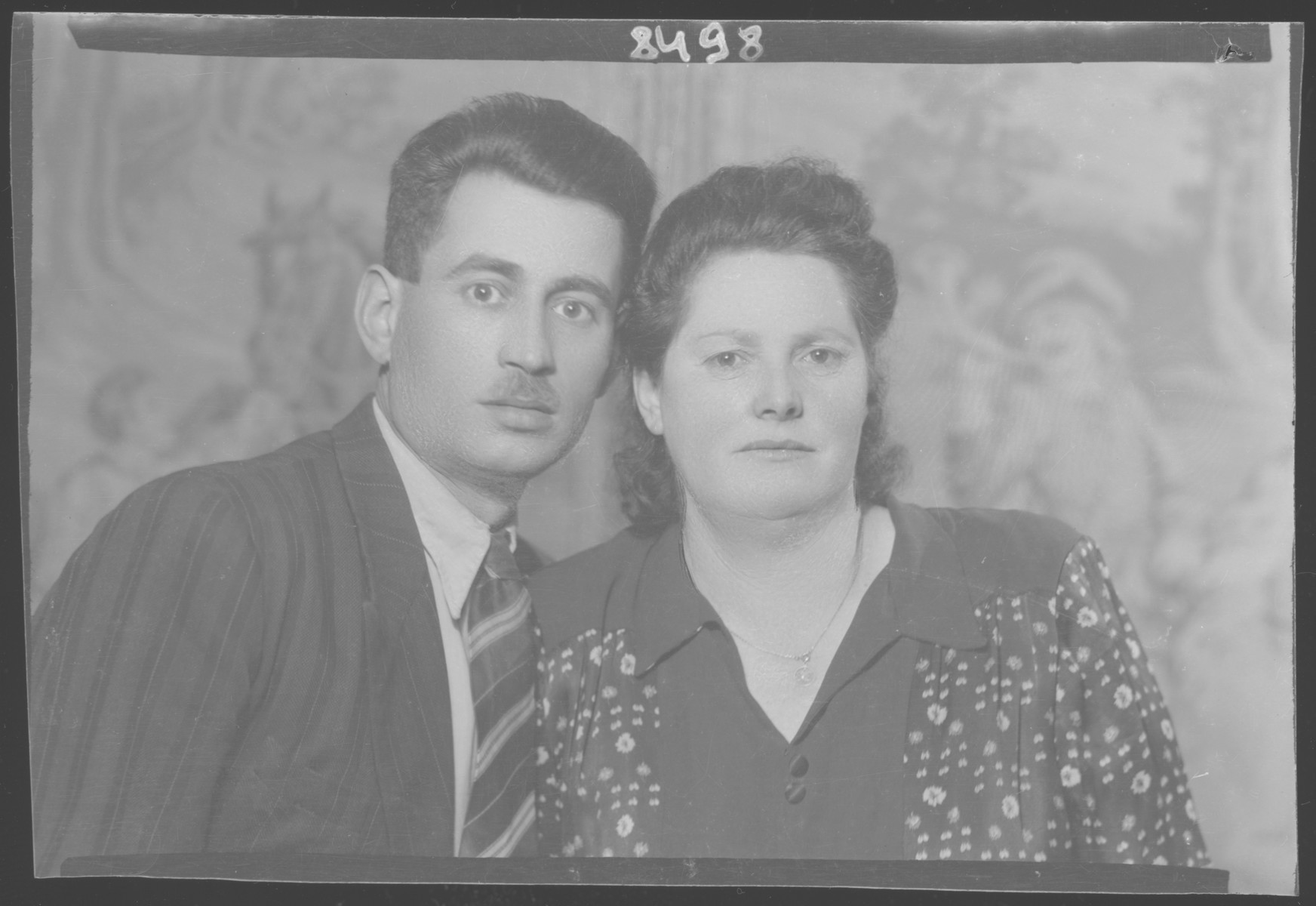 Studio portrait of Adolf Kohn and his wife Juliska.

This photograph was taken after the war.  Juliska was in Auschwitz; Adolf Kohn was in a labor camp, and they married after the war.  Adolf Kohn's first wife Malka perished in Auschwitz.