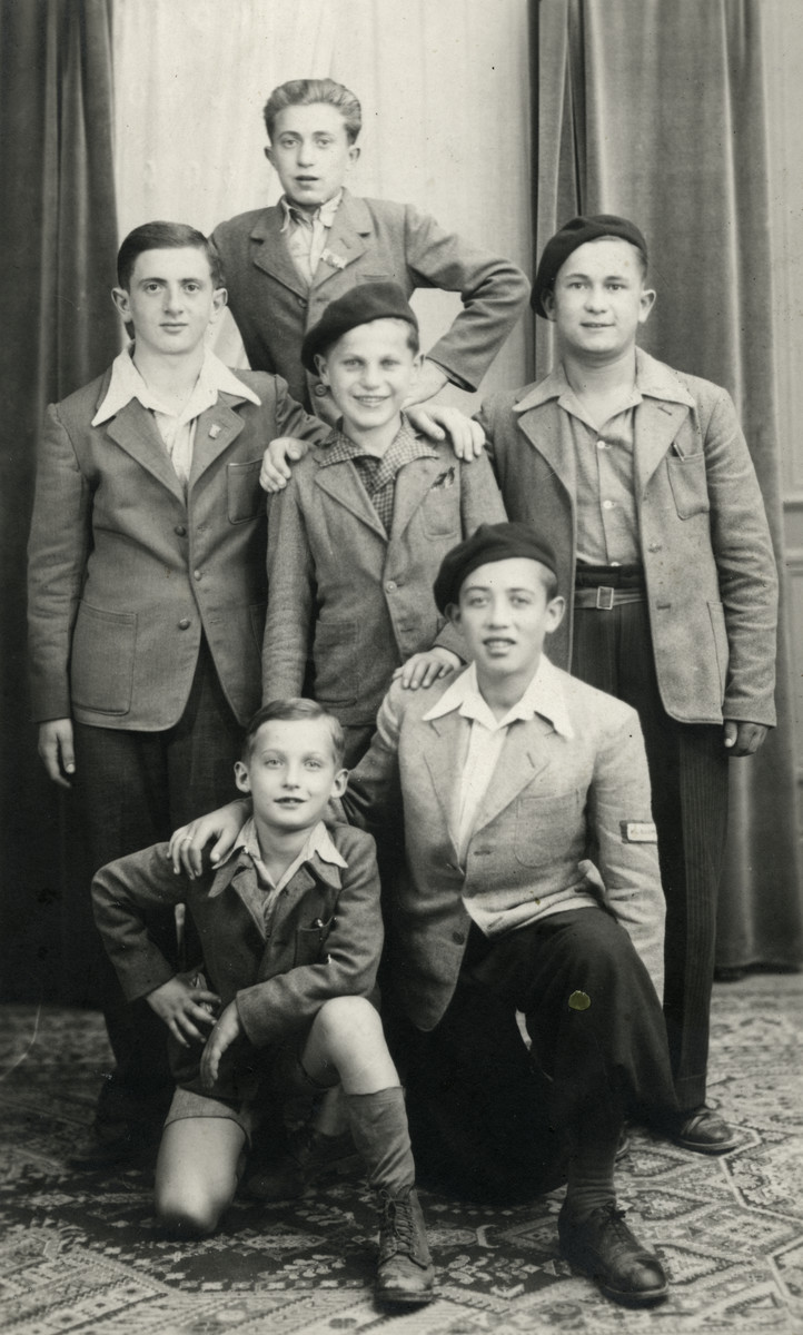 Group portrait of boys in the Ambloy children's home.

Pictured in the back, center is Abraham Tuszinsky, from Piotrkow.  Binem Wrzonski is pictured in the second row, on the left, Izio is in the first row on the left , and Jacques Rybsztjan is in the first row on the right.