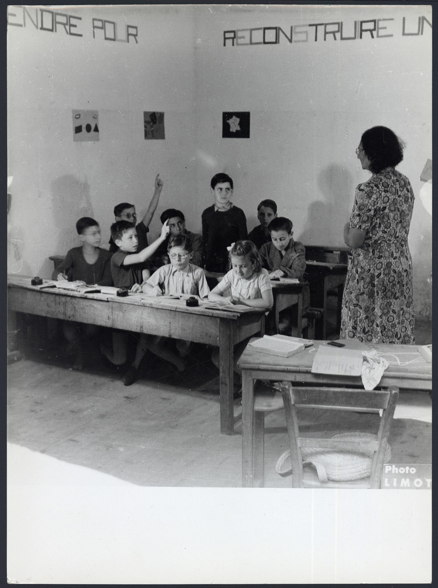 Children study in a classroom in the Masgelier postwar OSE children's home.