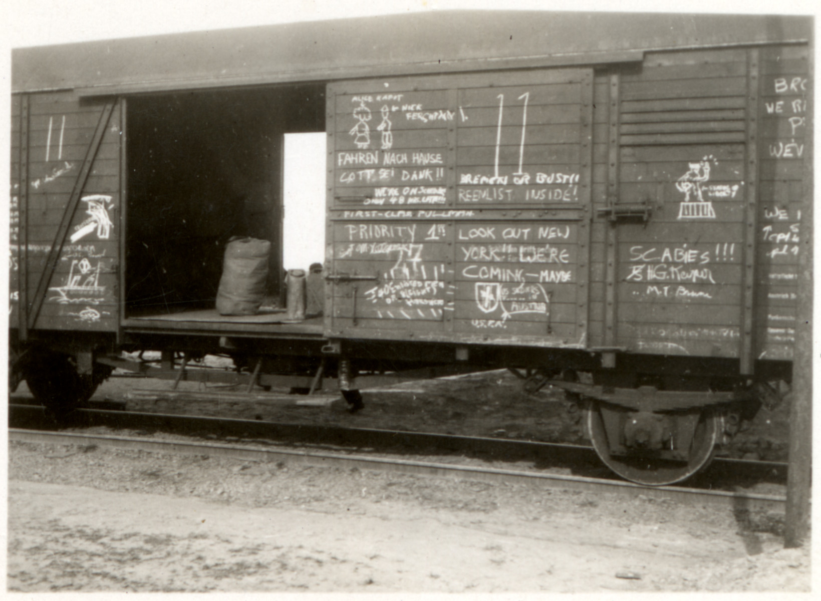 View of a cattle car used by American GIs and covered with their graffiti.