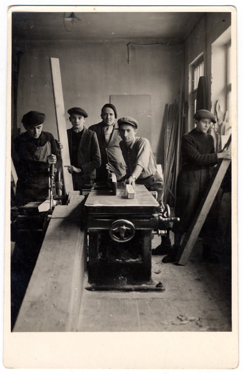 Young men work work in a carpentry shop at a combination yeshiva and vocational training school (hachsharah) in Hlohovec run by Rabbi Moritz Schwartz.

All the boys immigrated to Palestine.