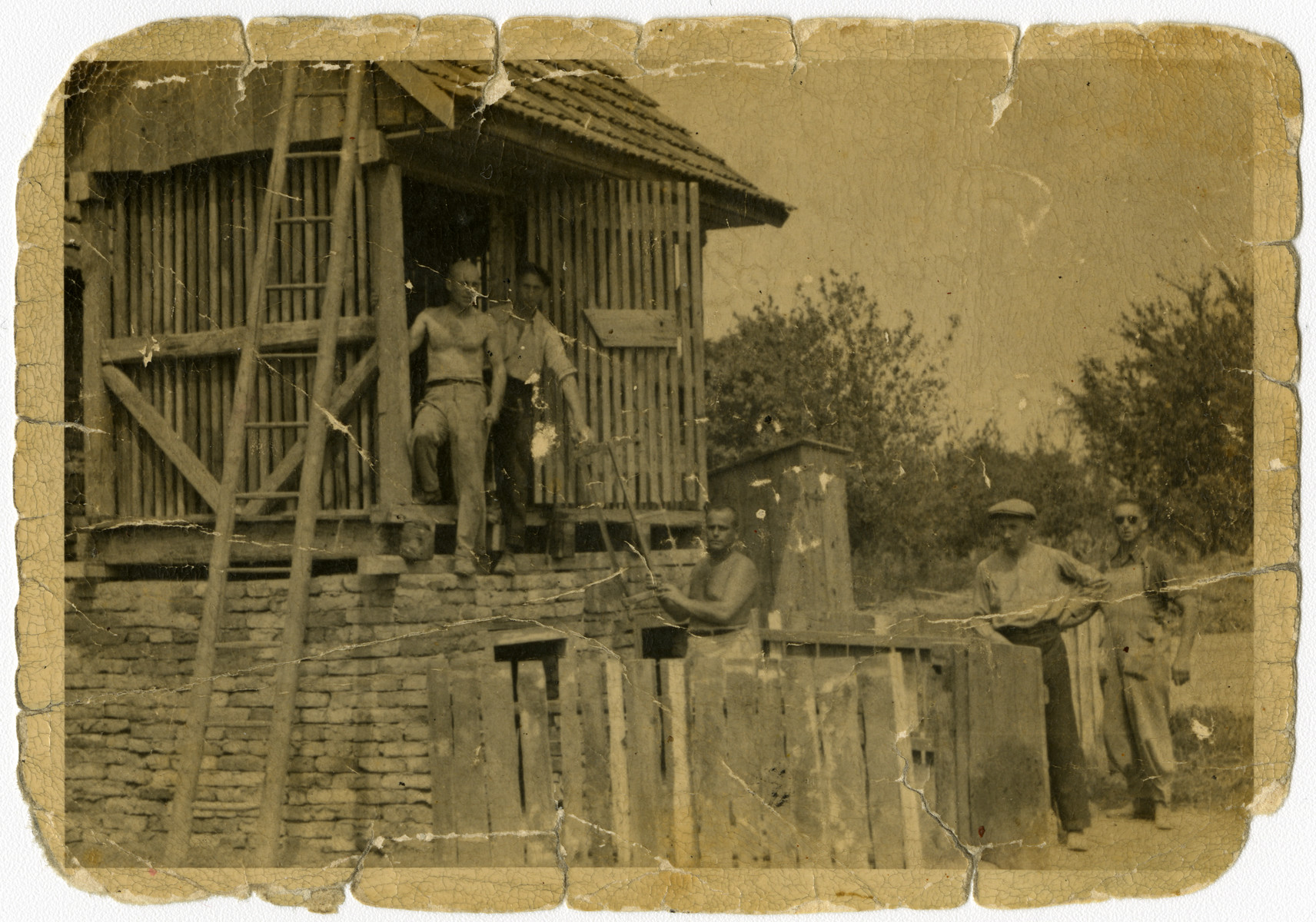 Serbian Jews are forced to work on a construction project.

Daniel Ripp is pictured in the structure on the right.