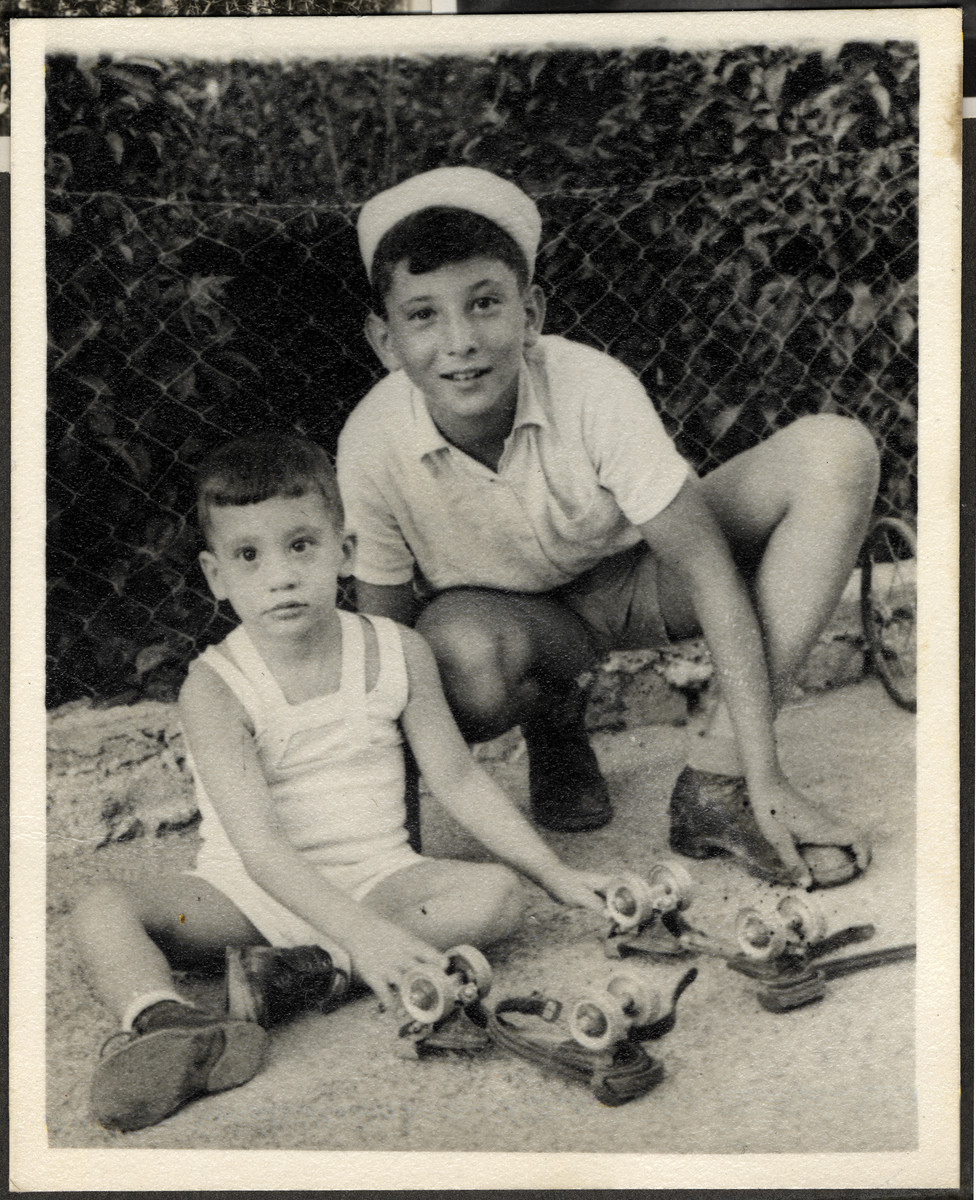 Manny Mandel poses with a younger disabled child and a pair of roller skates he received as a gift from America. 

Ella Mandel was caring for the child while the family lived in Haifa shortly after settling in Israel.