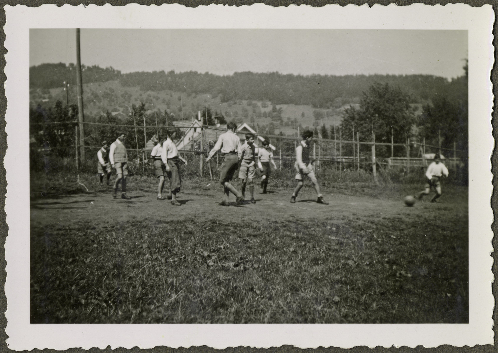 Children play soccer in a home in Heiden, Switzerland.

Manny Mandel is pictured third from the left.  The photograph was posed for the Red Cross.