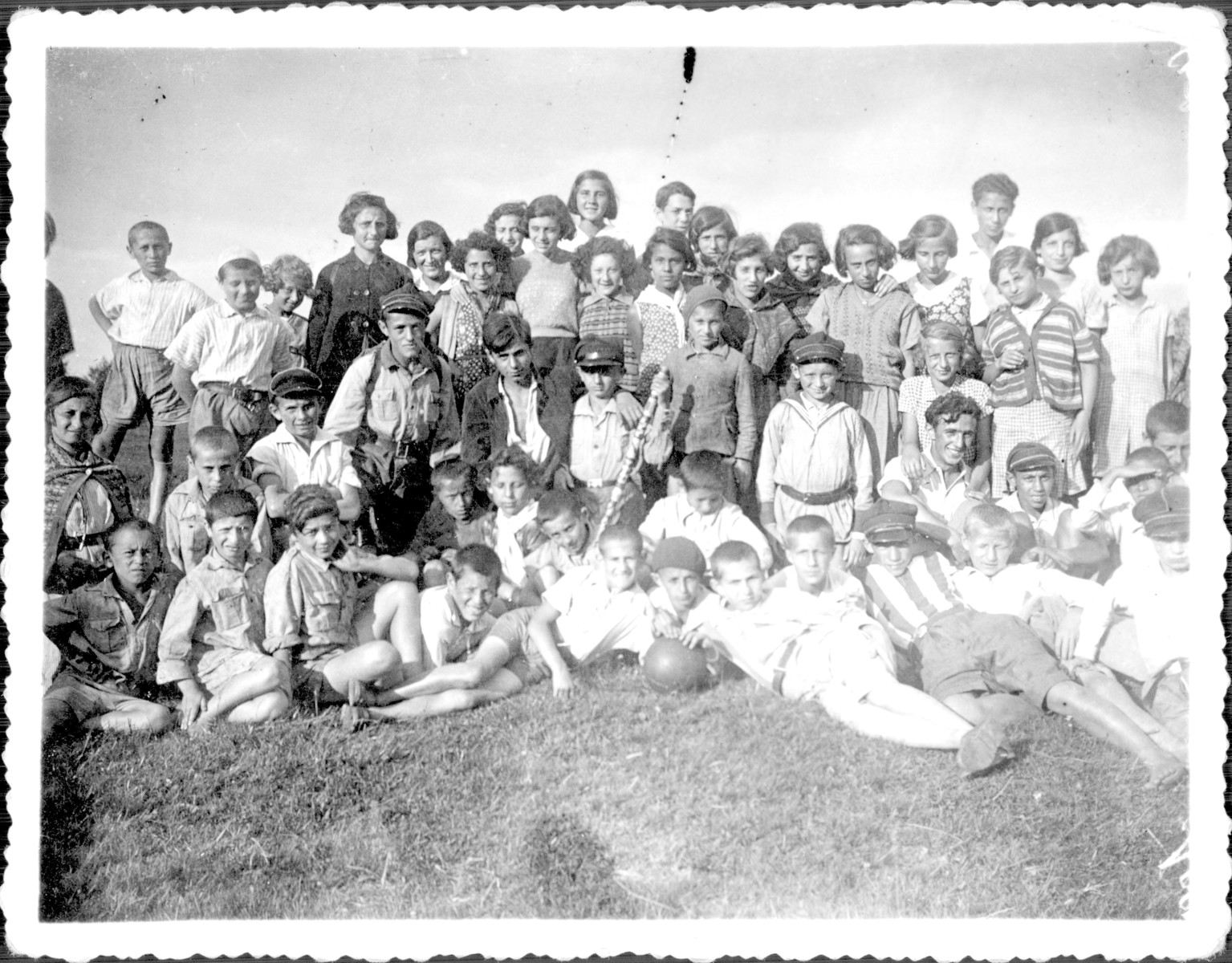 Members of Hashomer Hatzair from the Korczak Orphanage go a Lag B'omer outing.

Shlomo Nadel is pictured on the far right with a hat.