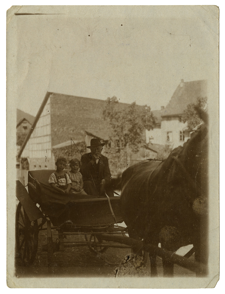 Norbert and Suse Mueller go for a horse and buggy ride with the owner of their family's house, who they called Uncle Menko.