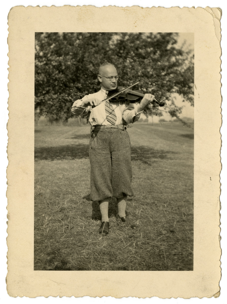 Sebald Mueller practices his violin.