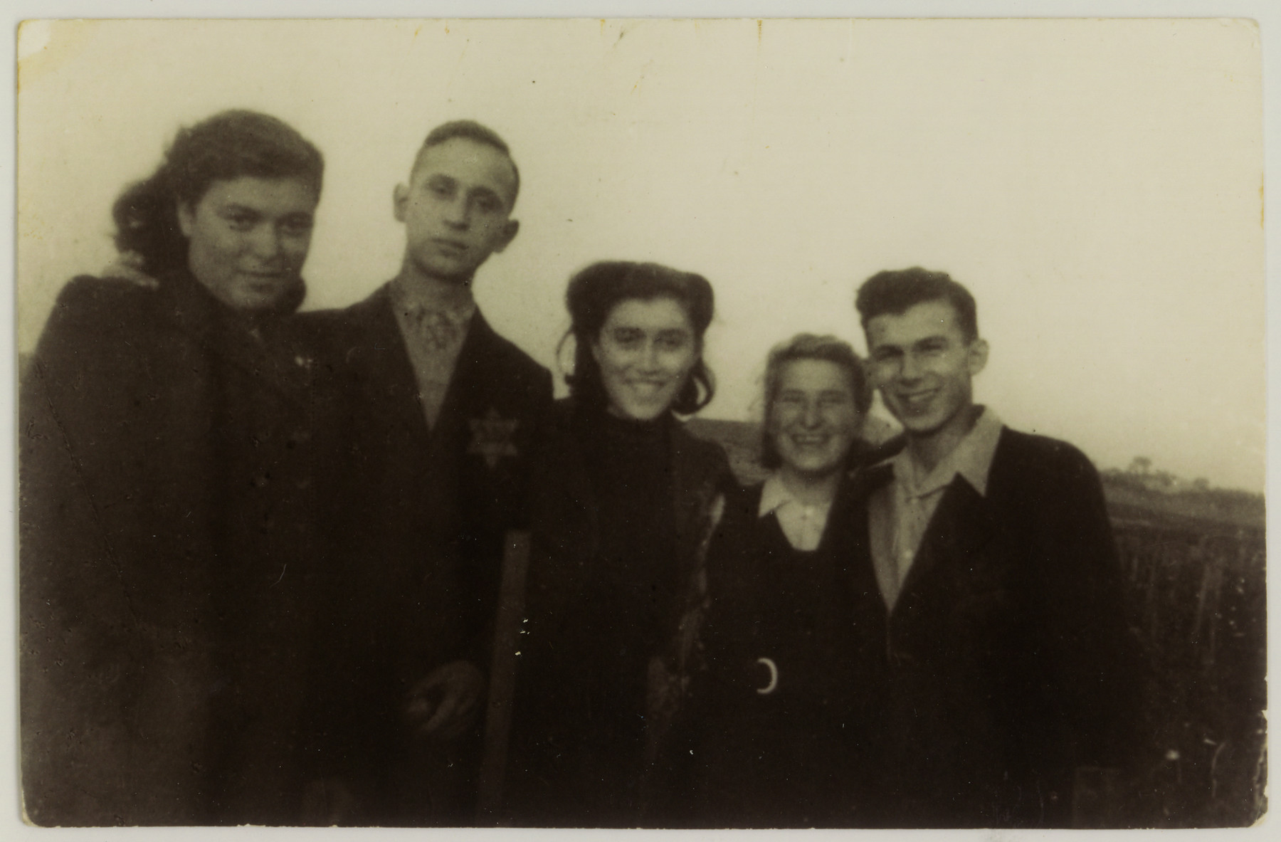 Portrait of five Jewish youth in the Dabrowa ghetto.