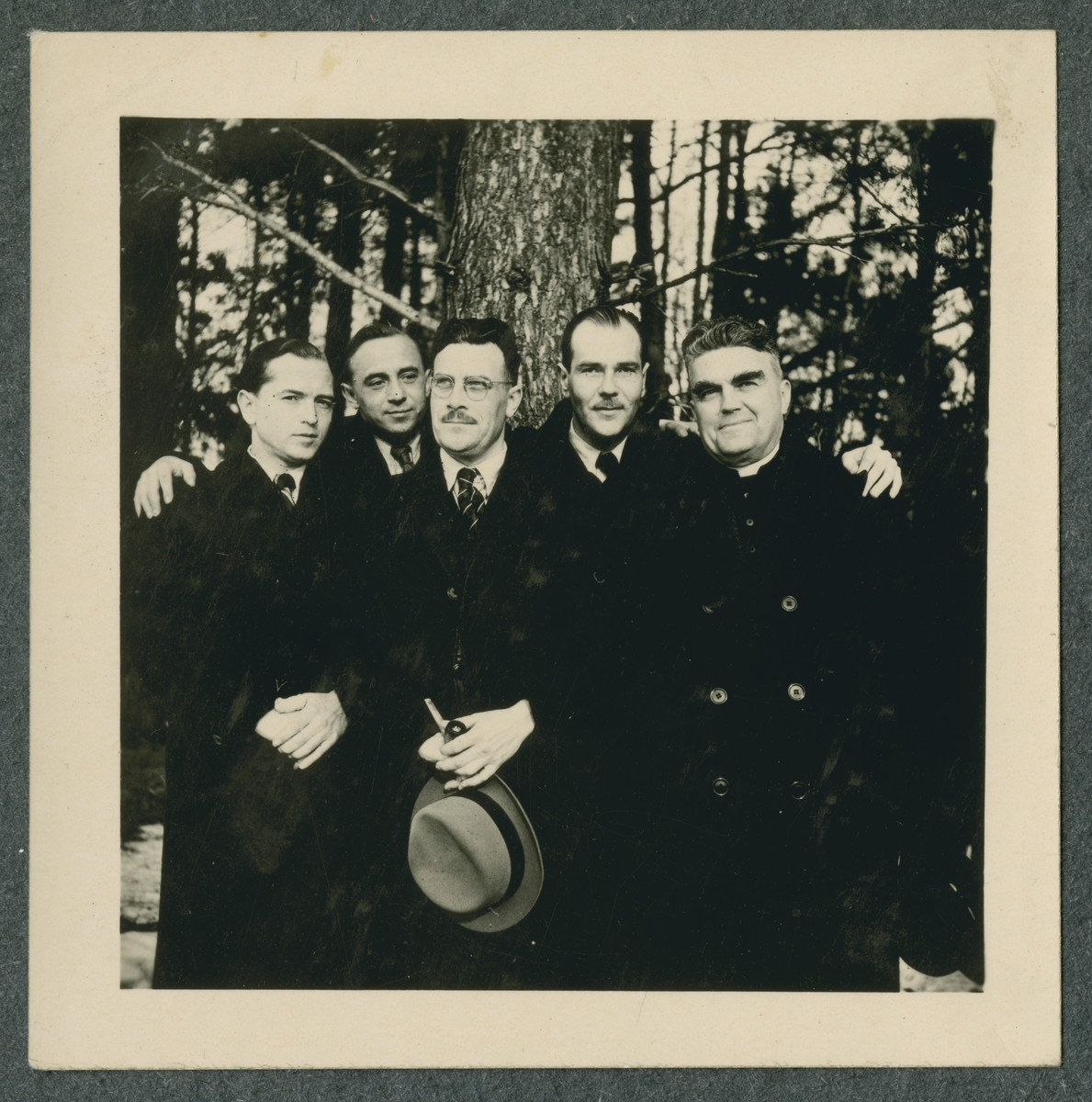 Group portrait of prisoners in the Tittmoning camp.

Father Sledz is pictured on the right.