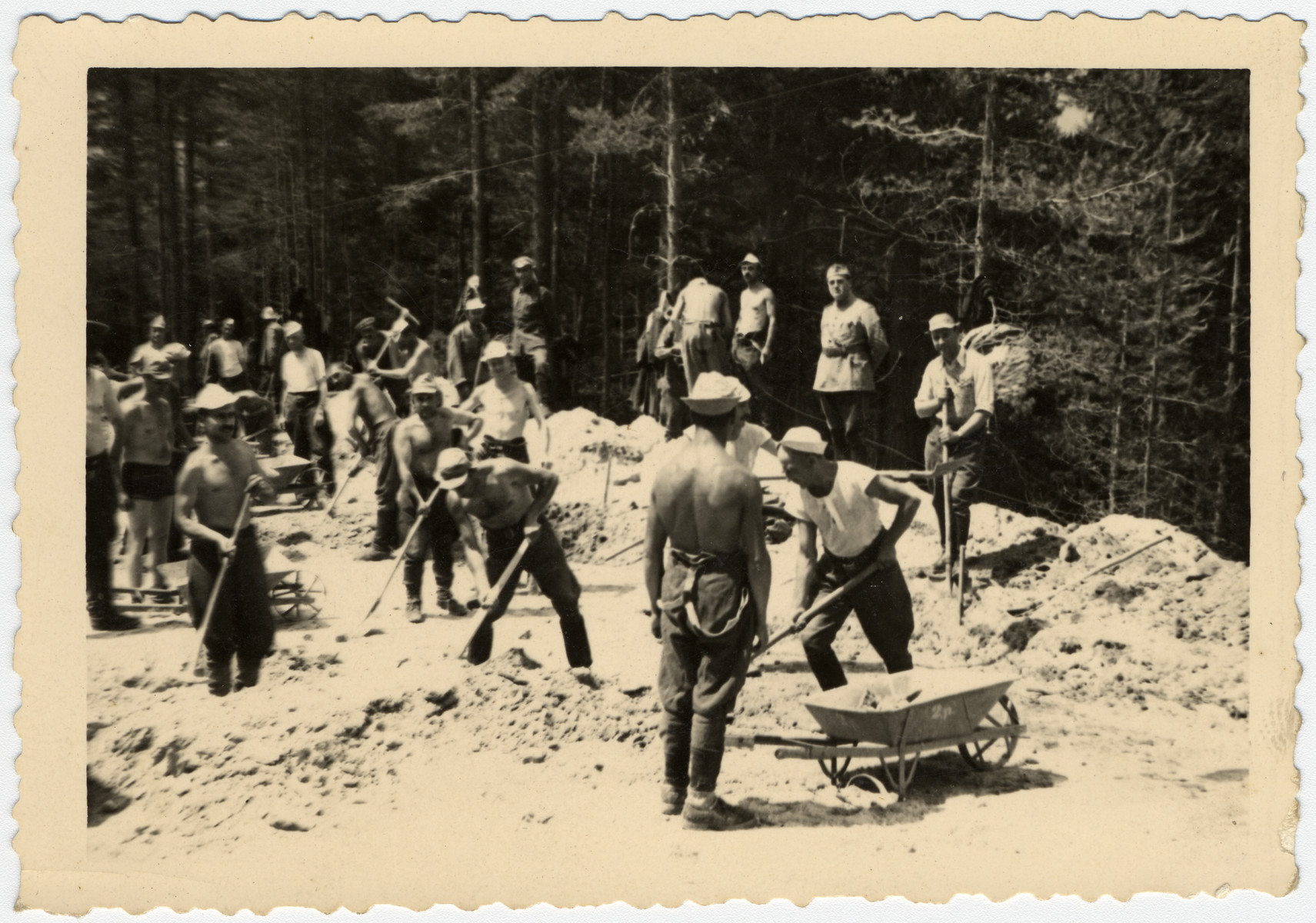 Bulgarian Jews dig a road in a forced labor brigade.

Standing in the back in his army uniform is Nissim Farhi.  In Bulgaria, Jewish officers were allowed to serve as officers in labor brigades and wear their uniforms.