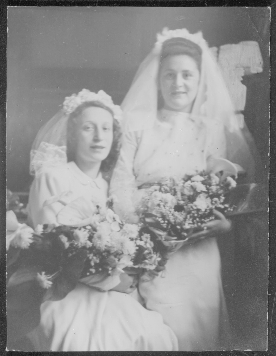 Close up portrait of two Jewish brides who were married in a double wedding ceremony that took place on Lag b'Omer, May 27, 1948 in the Prinz Albrecht Hall in Munich.  

Pictured on the left is Fajgl Fiszel, and on the right, Henni Kestenberg.