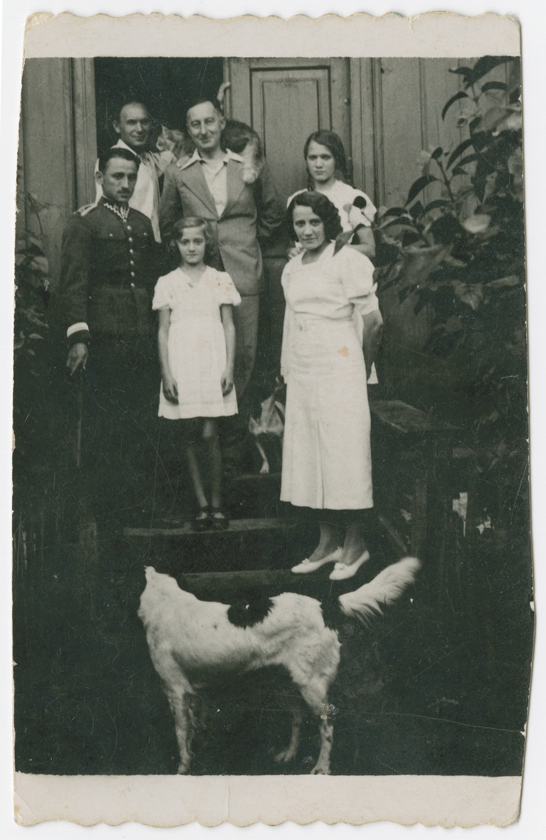 Dr. Maximilian Tendler, a doctor in Zelechow, poses among friends, with his pet cat on his shoulders