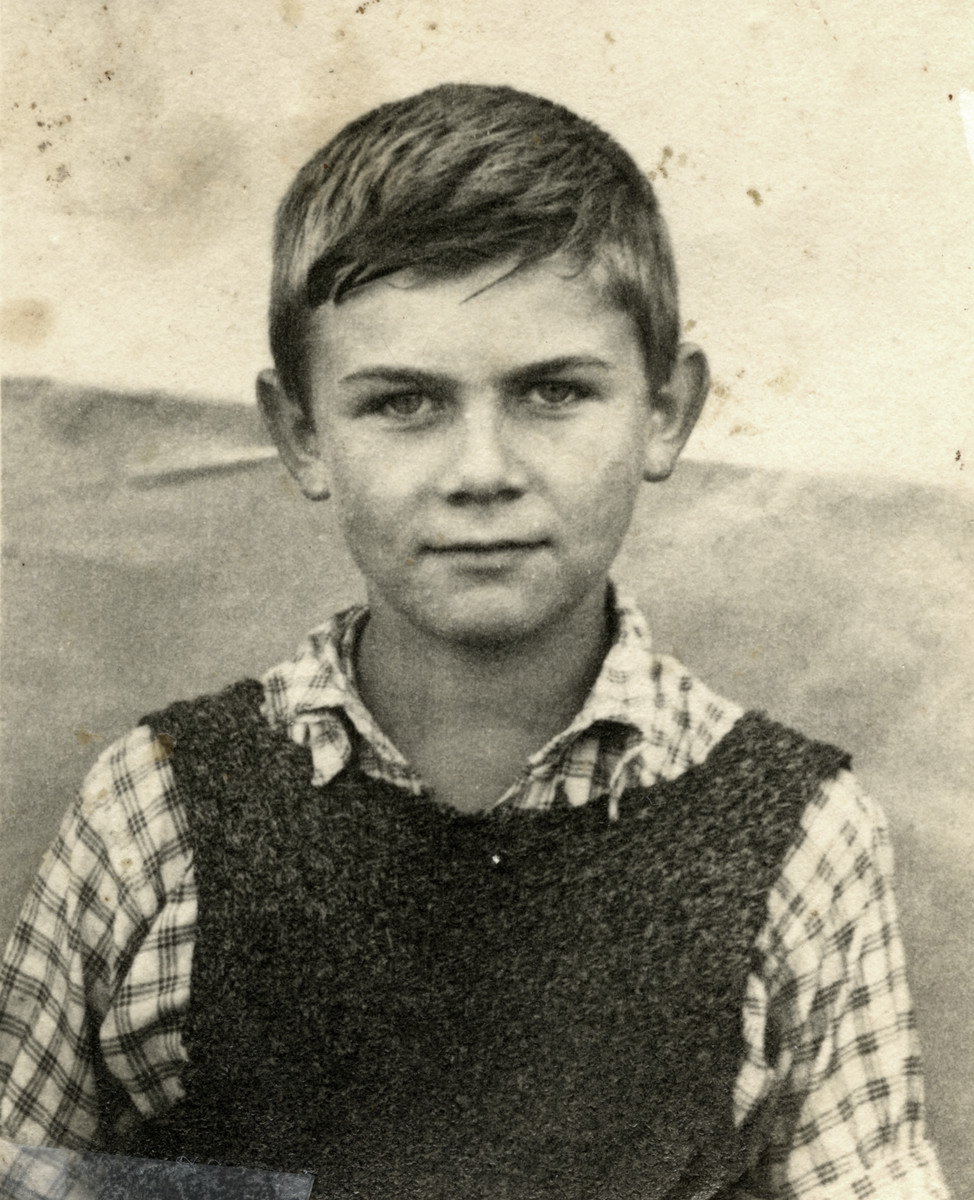 Portrait of child survivor Ziomek Hammer.

He is wearing a vest that his mother knitted for him; it was the only warm piece of clothing that he owned and which he wore throughout the ghetto and while in hiding.