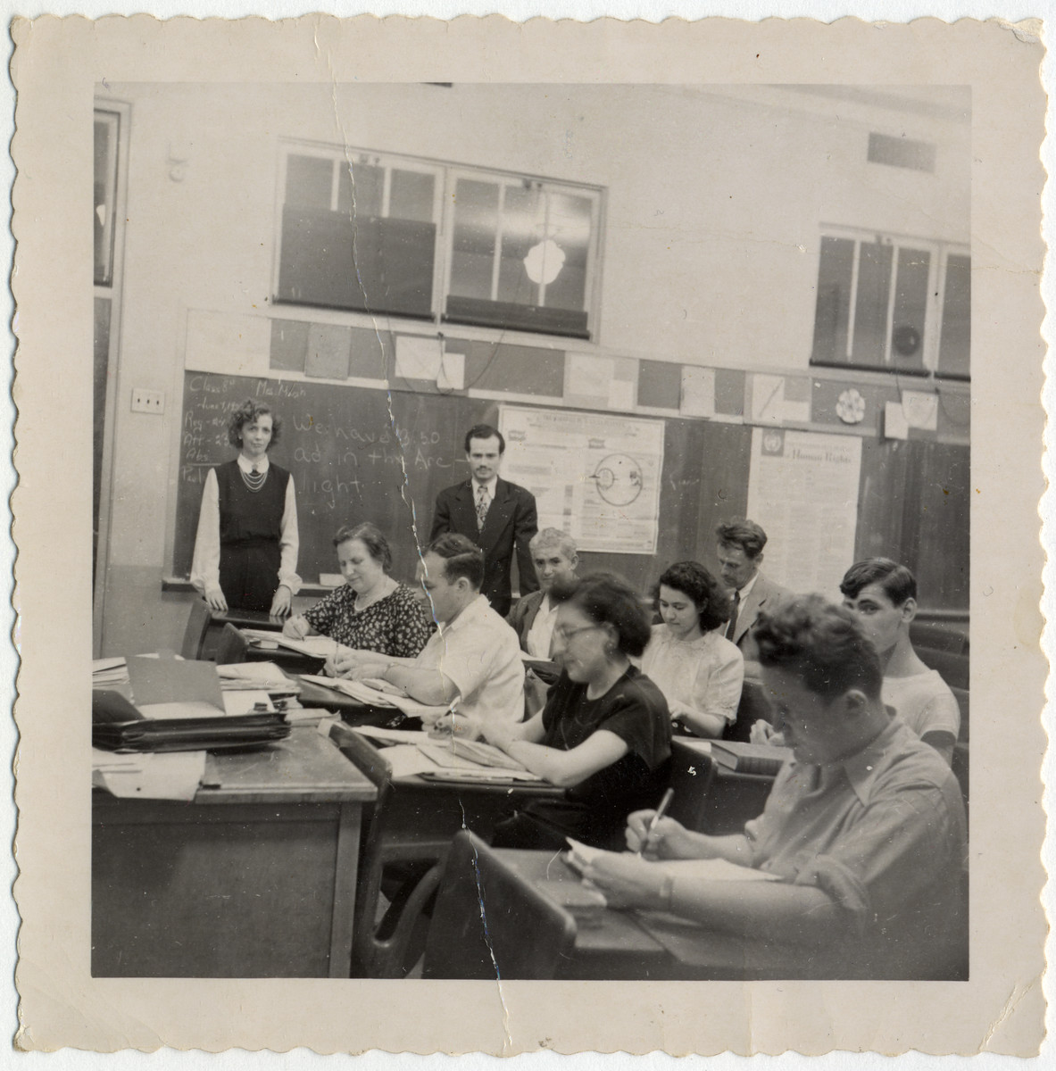 Group portrait of students in an English language class for Deaf immigrants, taught by Alice McVan, a Gallaudet alumna.

Among those pictured are Alice McVan (standing, far left); and (seated left to right) Hilda Wiener Rattner, Richard Wiener, Doris Fedrid, and Fred Fedrid.