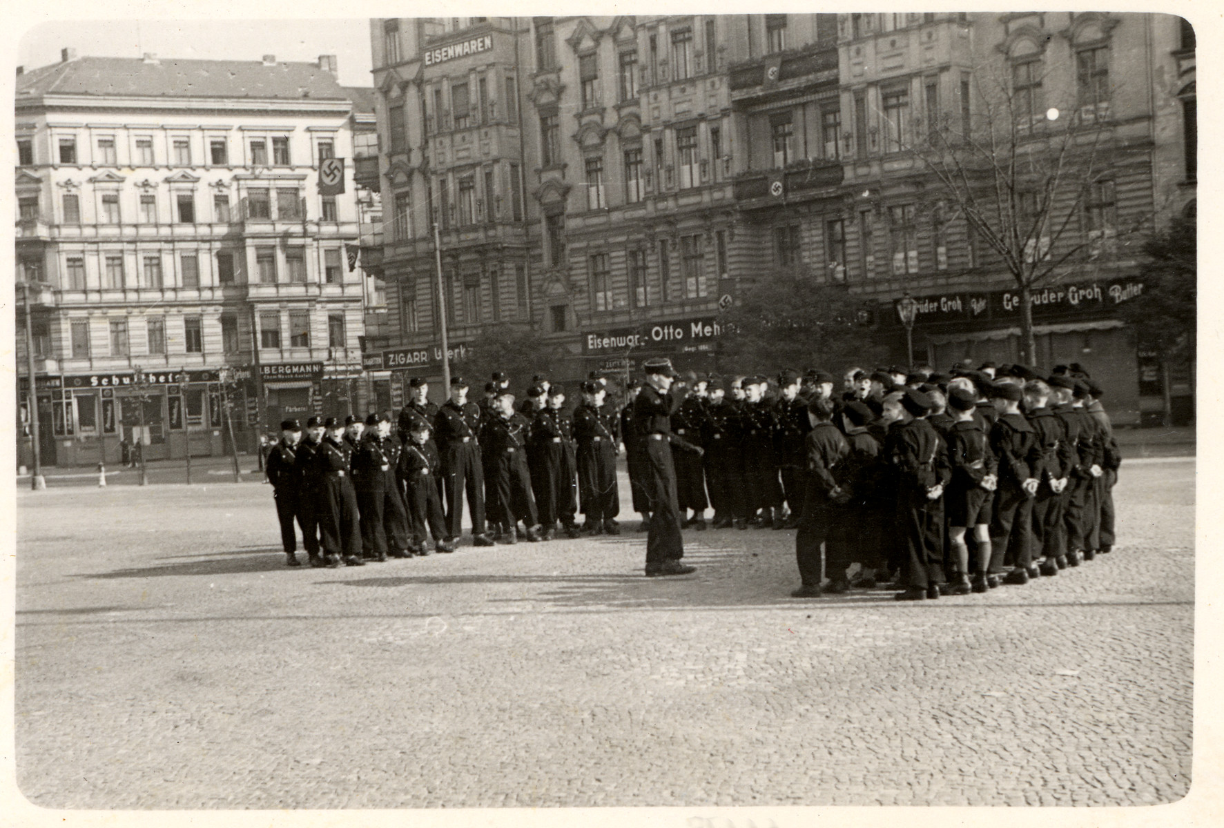Hitler Youth gather on a street in Germany. 
 
[This image from Berlin was found in the P-20-1939 contact book]