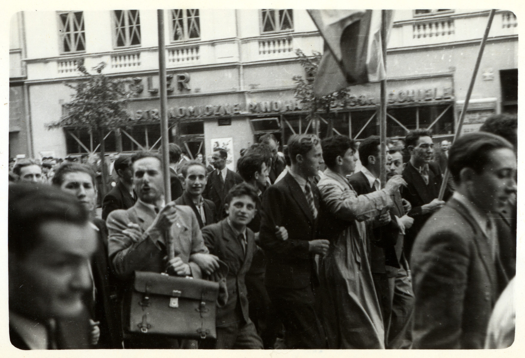 "A Moment of Confidence:" Poles celebrate in the streets at the news that England and France declared war on Germany. 

[The book "Warsaw" by Julien Bryan states that this photograph was taken on September 3, 1939 but Mr. Bryan himself did not arrive in Warsaw until the 7th of that month. This information does not match up, thus the tentative date.]