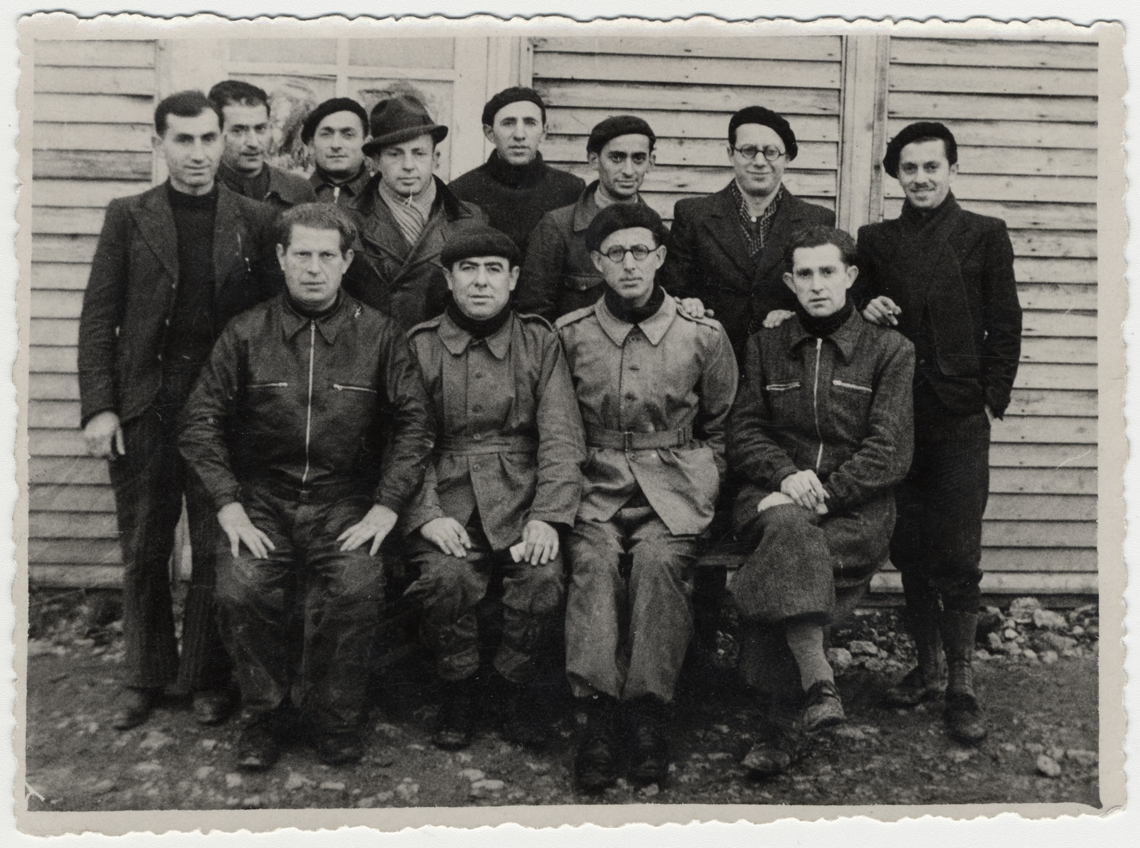 Group portrait of Jewish prisoners in the Beaune-la-Rolande internment camp.

Pictured seated is Itzrik Sztal (far left).  Standing are Moishe Sztal (far left), Chil Jankiel Sztal (second from left) and Jankiel Michalowicz (sixth from the left).