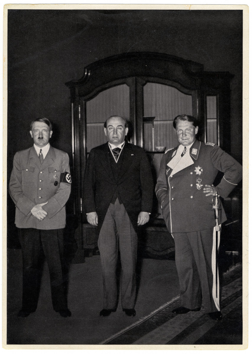 Caption reads:

"Visit to the Reich Chancellery (Prime Minister Gombos) 

Gyula Gombos was the prime minister of the Kingdon of Hungary from 1932-1936.