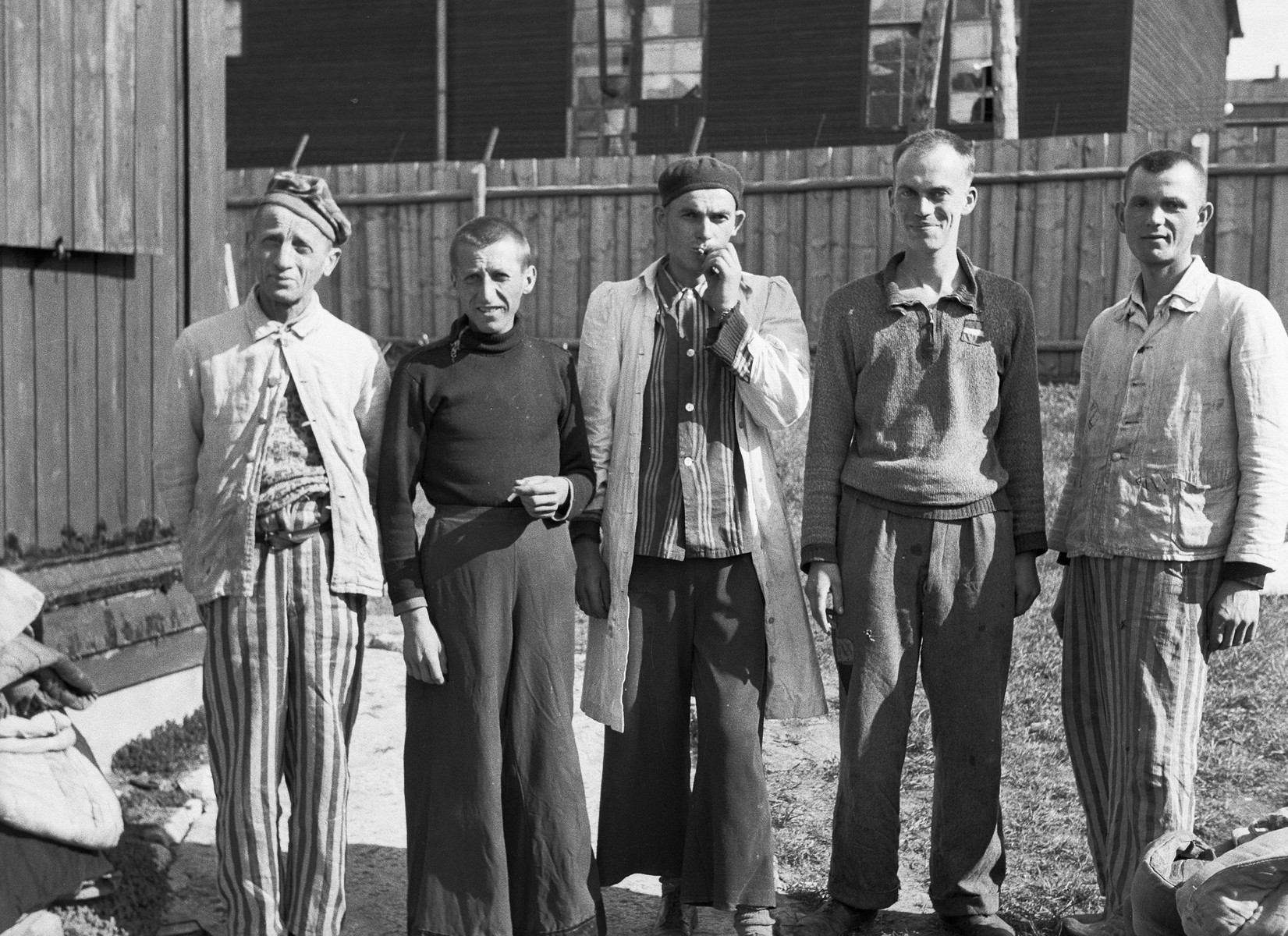 Survivors at Buchenwald pose for a photograph taken by a U.S. Army medical officer with the 45th Evacuation Hospital.  

The 45th Evacuation Hospital arrived at Buchenwald after liberation of the camp and was tasked with providing a range of care to newly liberated inmates. Their duties were soon directed to the treatment and evacuation of inmates suffering from tuberculosis.  With the assistance of several prisoners who had been camp physicians, the 45th managed to prevent further spread of the disease and to vastly improve the quality of treatment that individuals received.