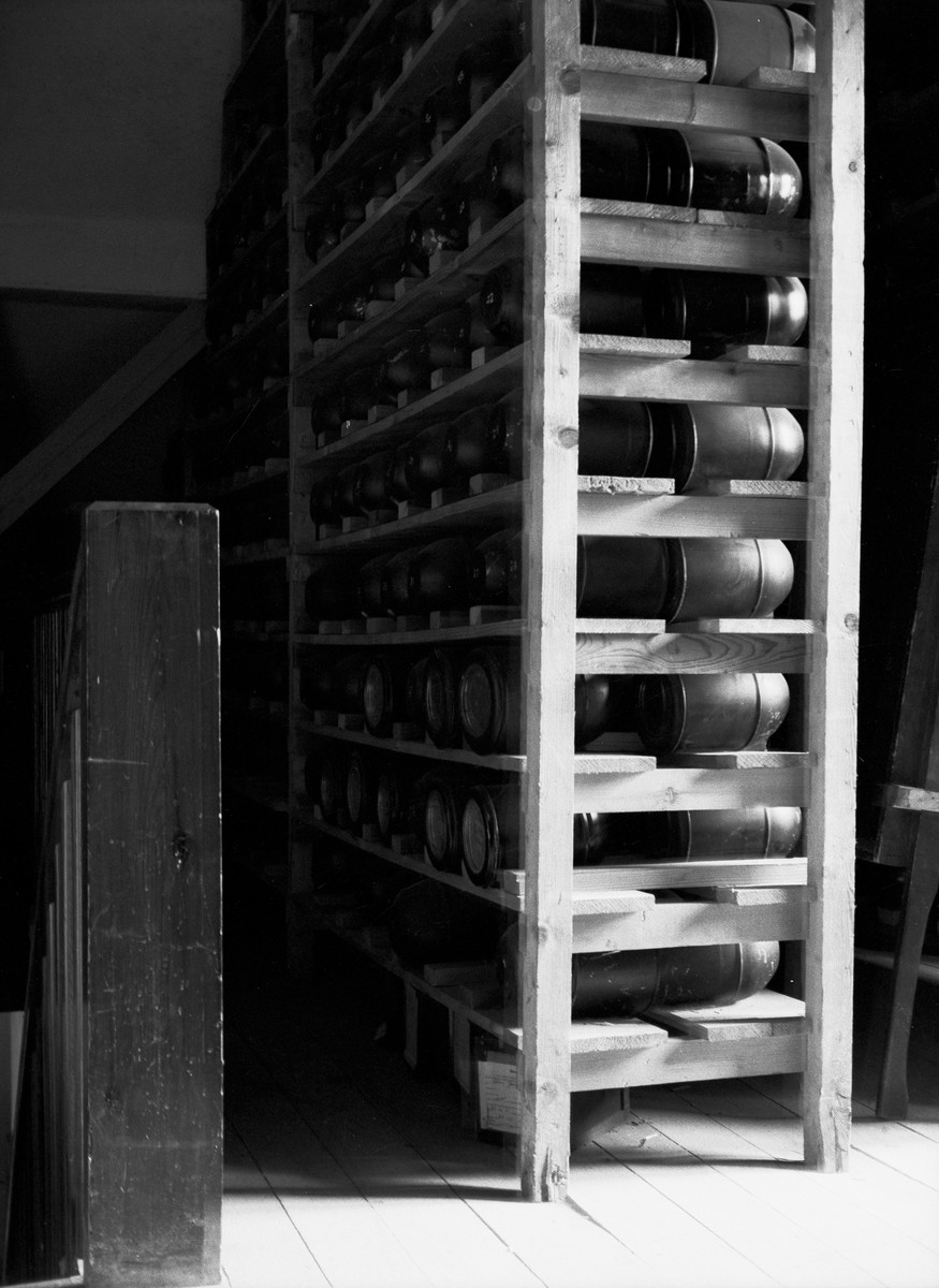 Urns to be used for human remains stacked upon shelves at Buchenwald.