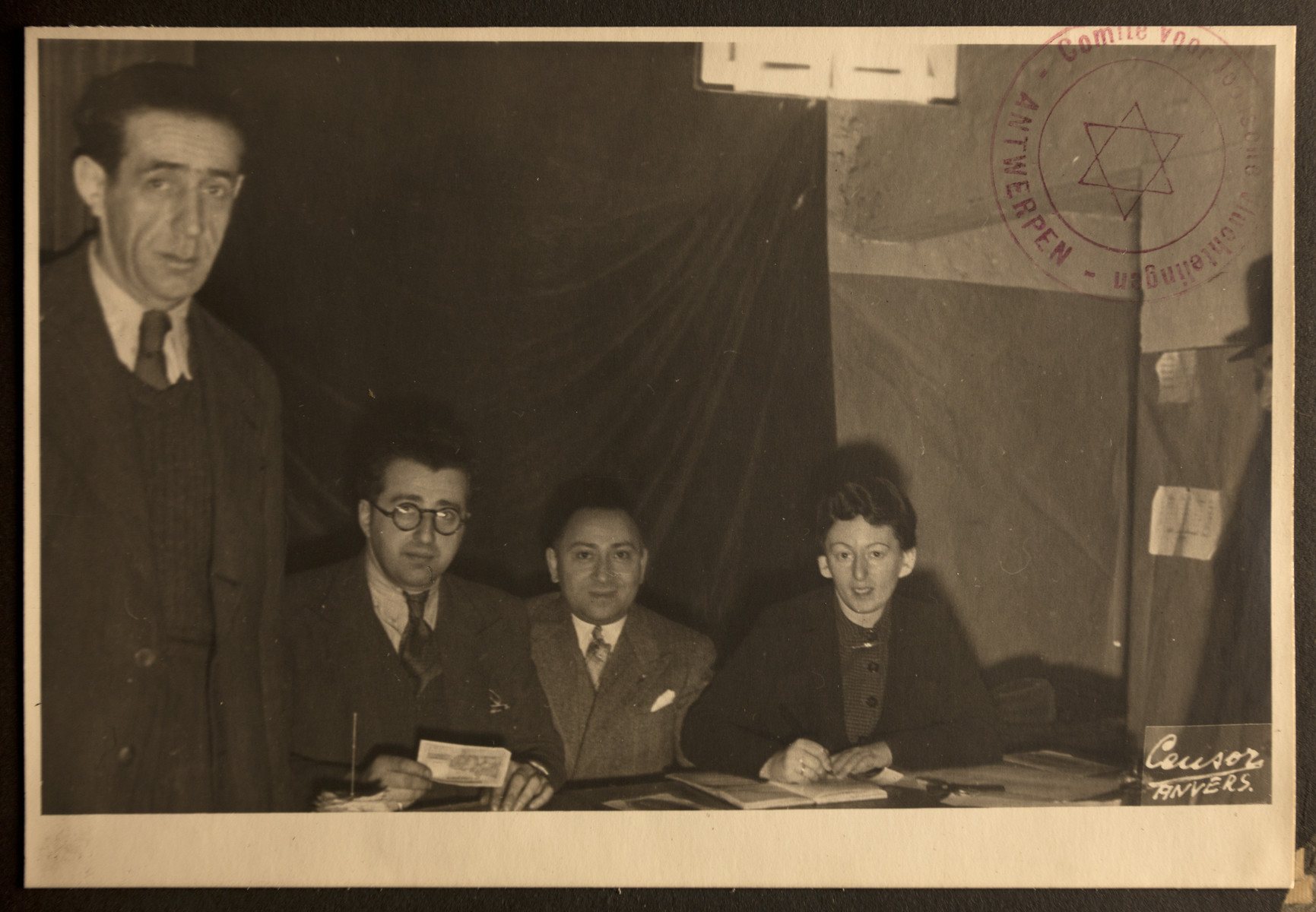 Group portrait of members of the Jewish Refugee Aid Committee of Antwerp.

Leopold Guttman is seated second from the left.