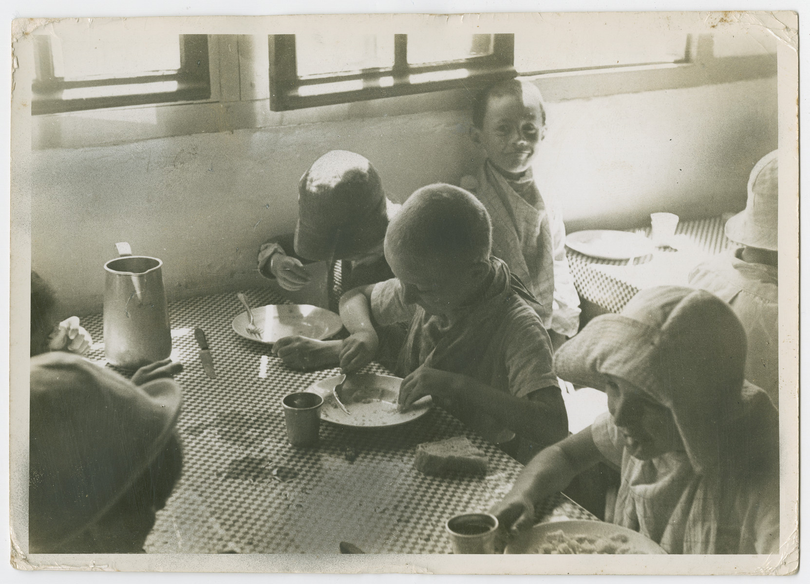 German Jewish refugee children eat a meal in a children's home in France.  

Photograph is used on page 34 of Robert Gessner's "Some of My Best Friends are Jews."  The pencil inscription on the back of the photograph reads, "France."