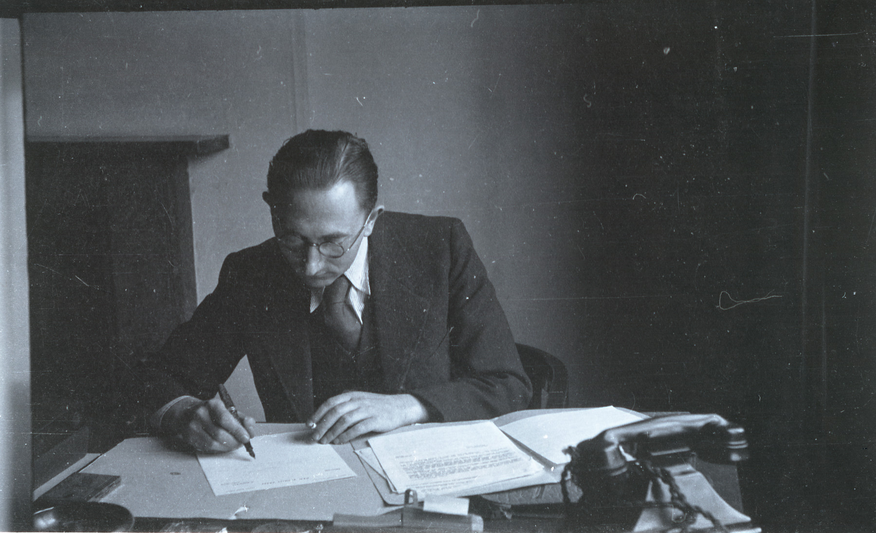 A member of the Revisionist Zionist organization in London works at his desk.