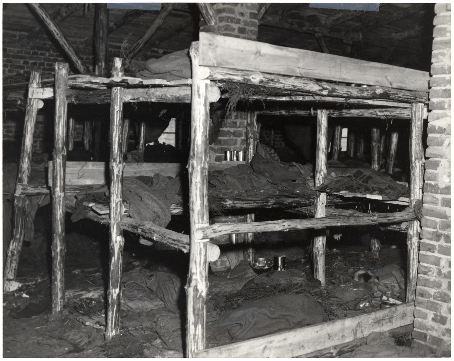 View of prisoners' bunks in a barracks in the Woebbelin concentration camp.
