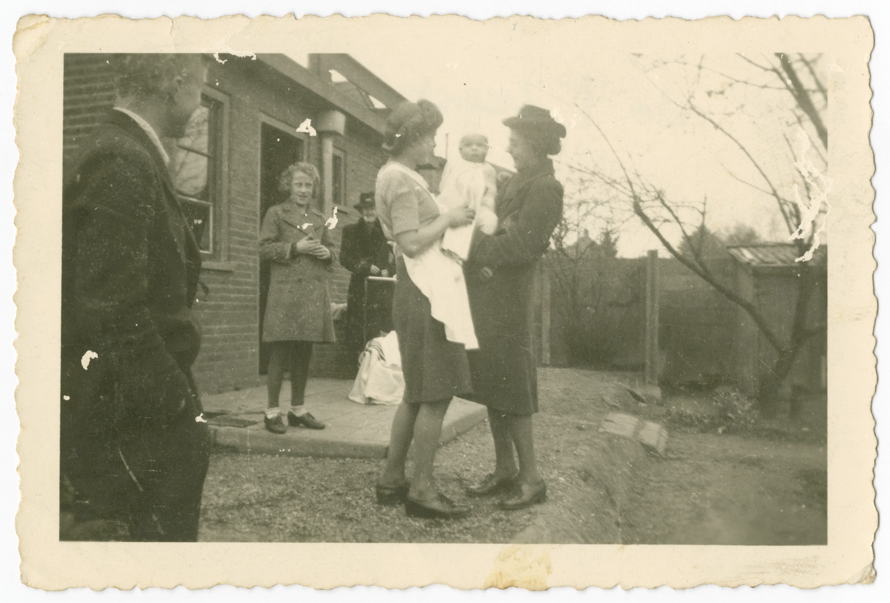 Members of the Wikkerink family stand outside their home shortly after Aaron Jedwab, a Jewish infant, was left on their doorstep.