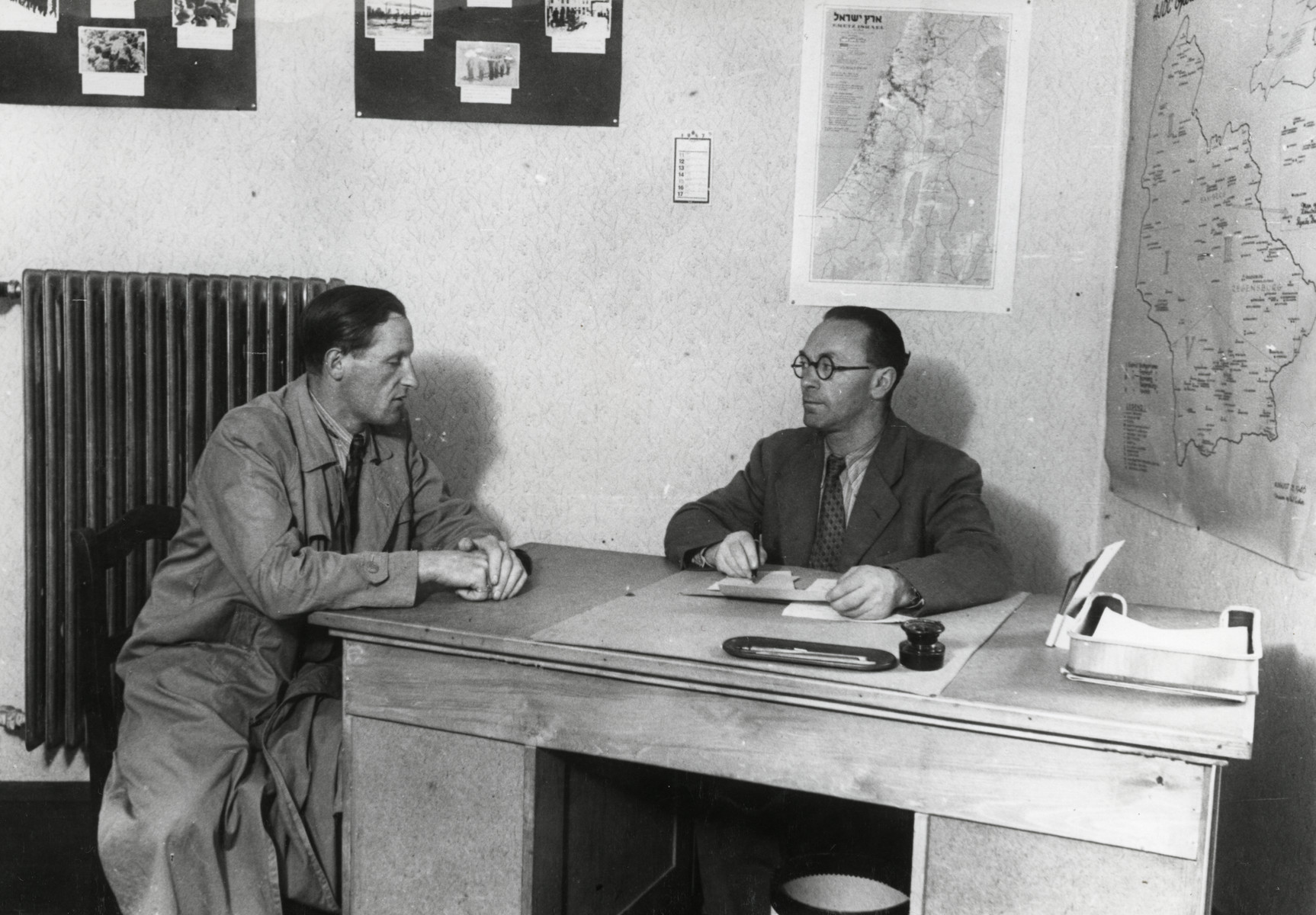 Writers David Wolpe (left) and Israel Kaplan work in their office in the Munich displaced persons' camp.