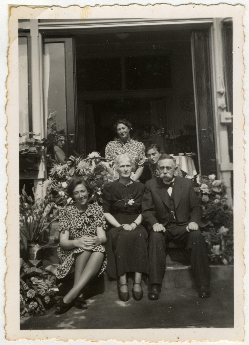 The van Dam family poses outside their home in Enschede.

Pictured sitting Hetty, Clara and Isidoor van Dam.  Standing are Minnie and Edith.