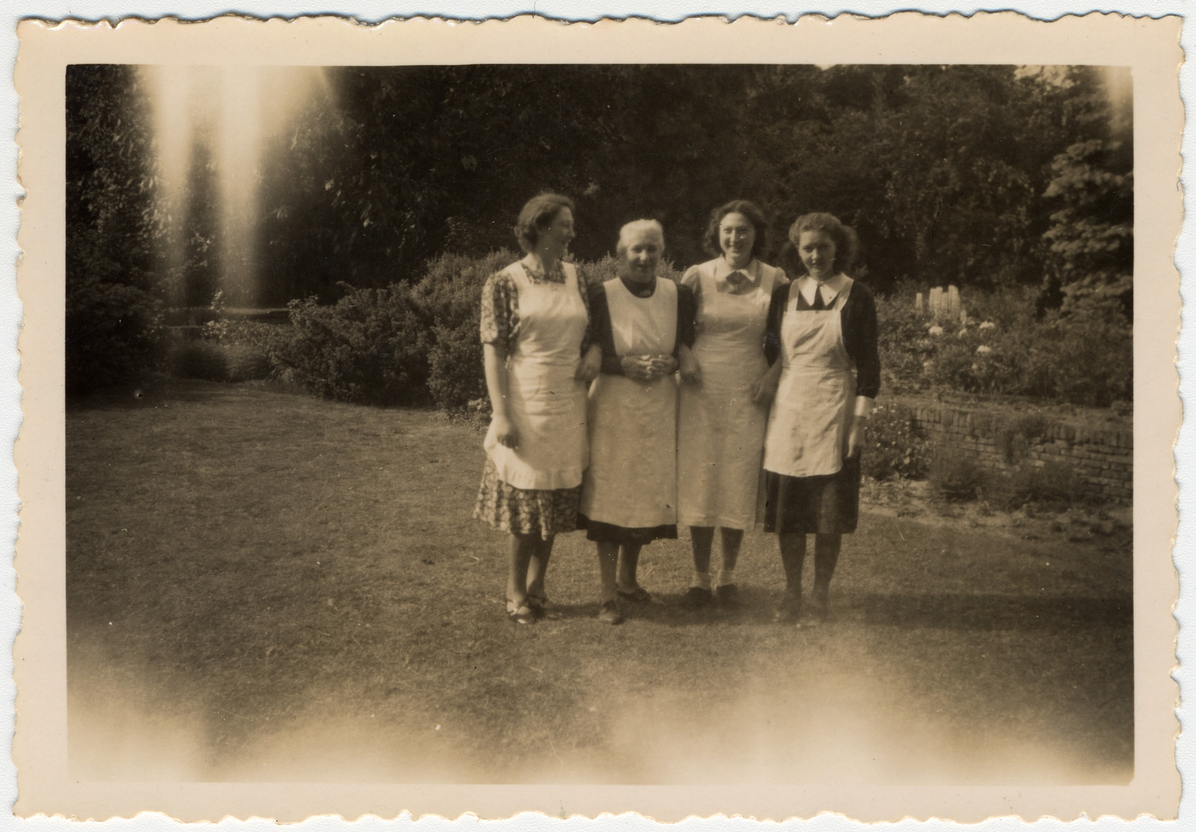 Group portrait of the van Dam family prior to their going into hiding.  

Pictured are Hettie, Clara, Minnie and Edith van Dam.