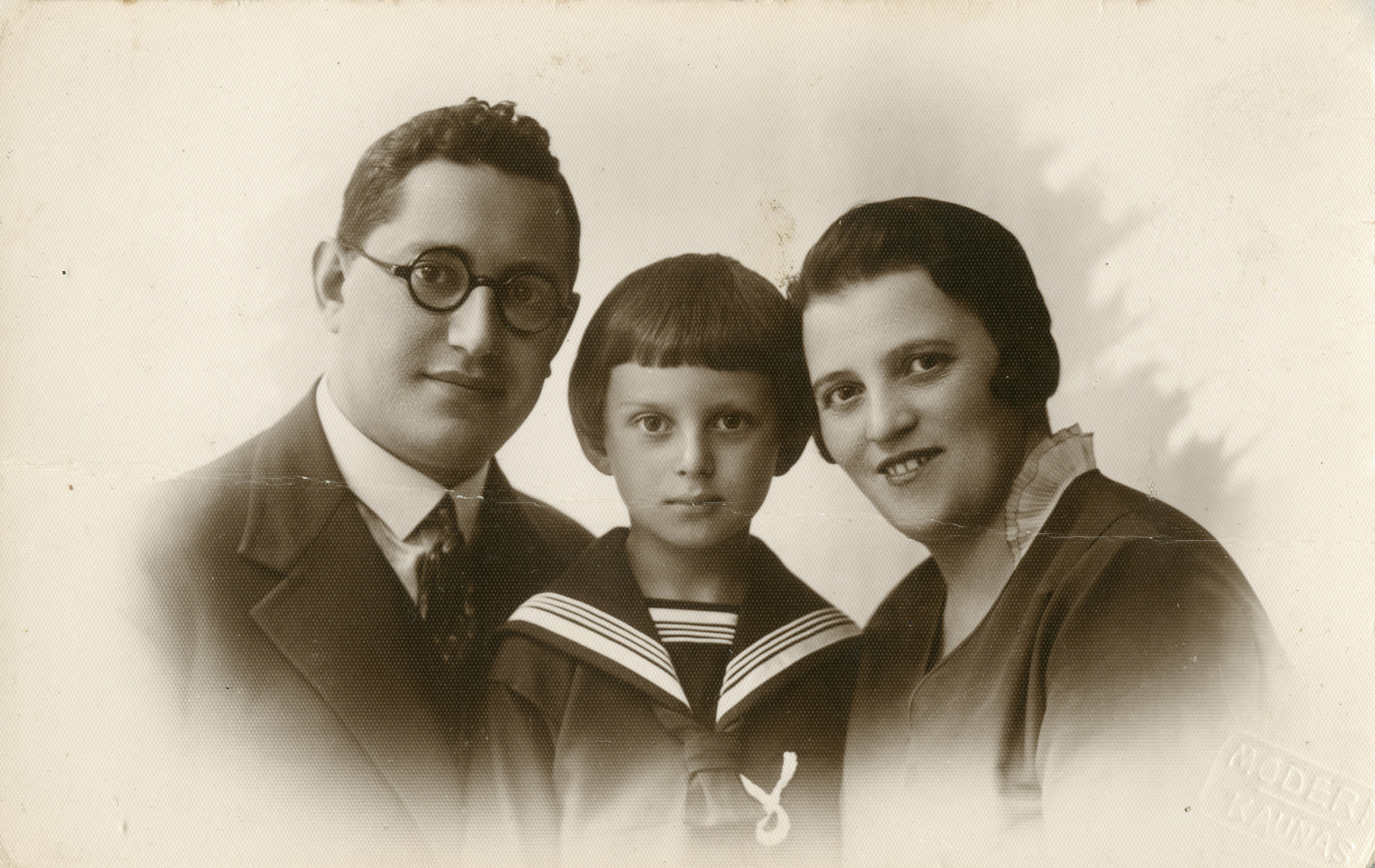 Studio portrait of Moshe Godroff and his wife Masha Gilerovich with their son Yaakov. 

The family perished.